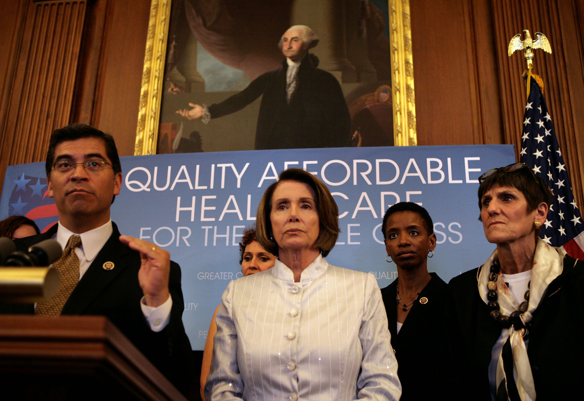 Rep. Xavier Becerra speaks next to Speaker of the House Nancy Pelosi during a news conference on America's Affordable Health Choices Act