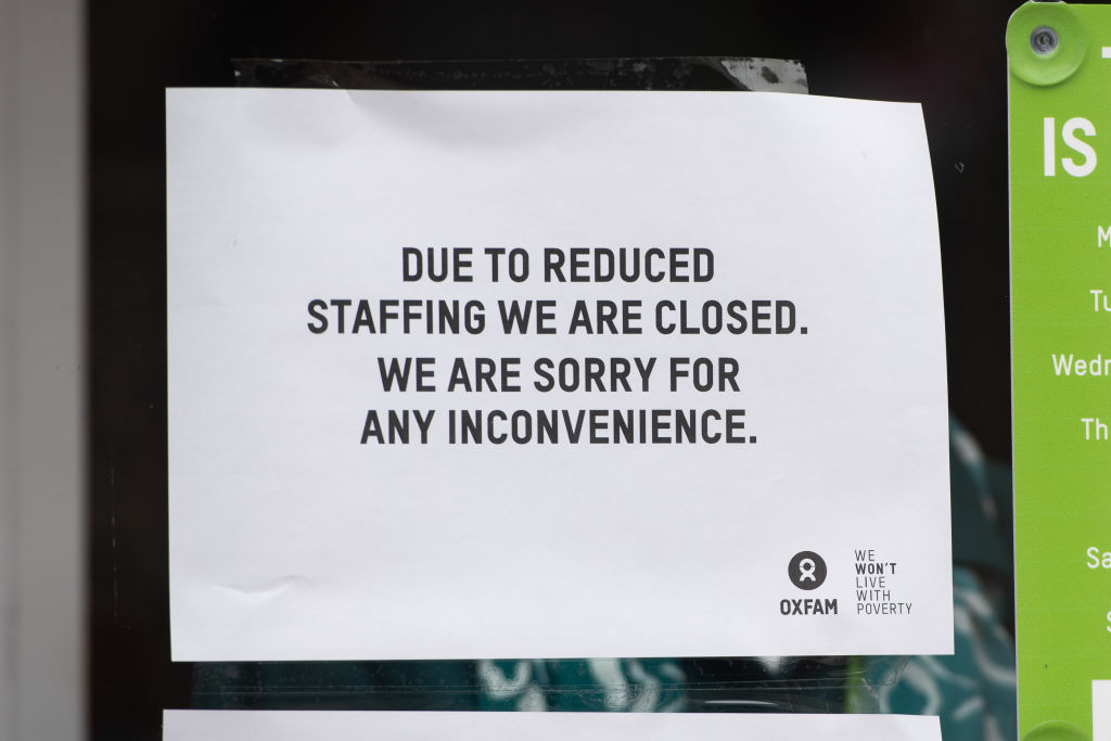 A sign in the window of an Oxfam charity shop informing of its closure due to reduced staffing on March 17, 2020 in Cardiff, United Kingdom. (Polly Thomas—Getty)