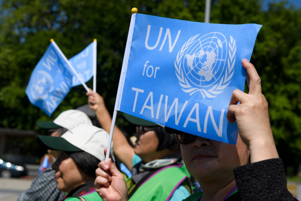 A pro-Taiwan protester holds a flag outside of the United Nations offices on the opening day of the World Health Organization's annual meeting in Geneva on May 22, 2017. (Fabrice Coffrini—AFP/Getty Images)