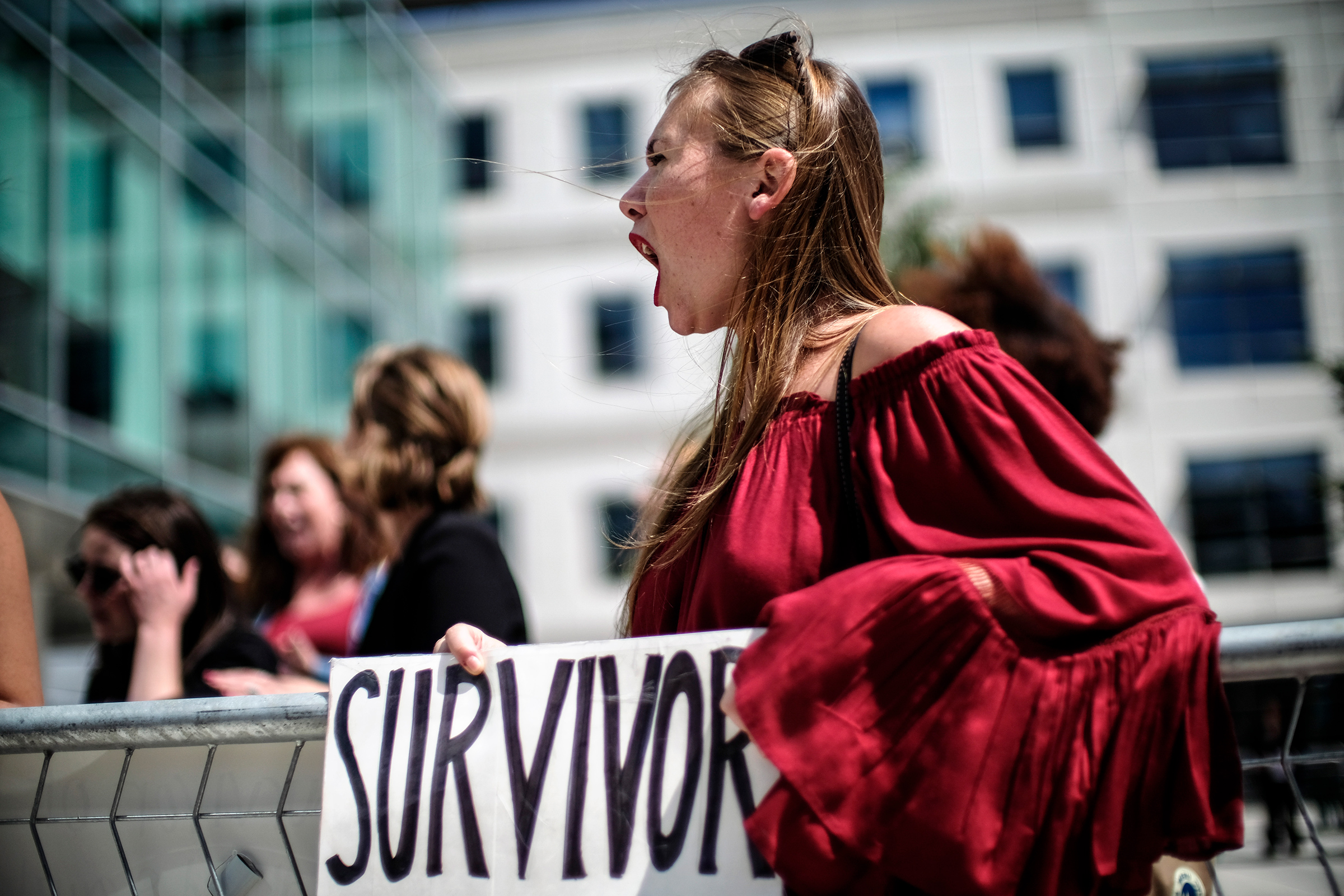 Meghan Downey protests outside as U.S. Education Secretary Betsy DeVos announces changes in federal policy on rules for investigating sexual assault reports on college campuses in Arlington, Virginia  on Sep. 7, 2017. (J. Lawler Duggan—The Washington Post via Getty Images)