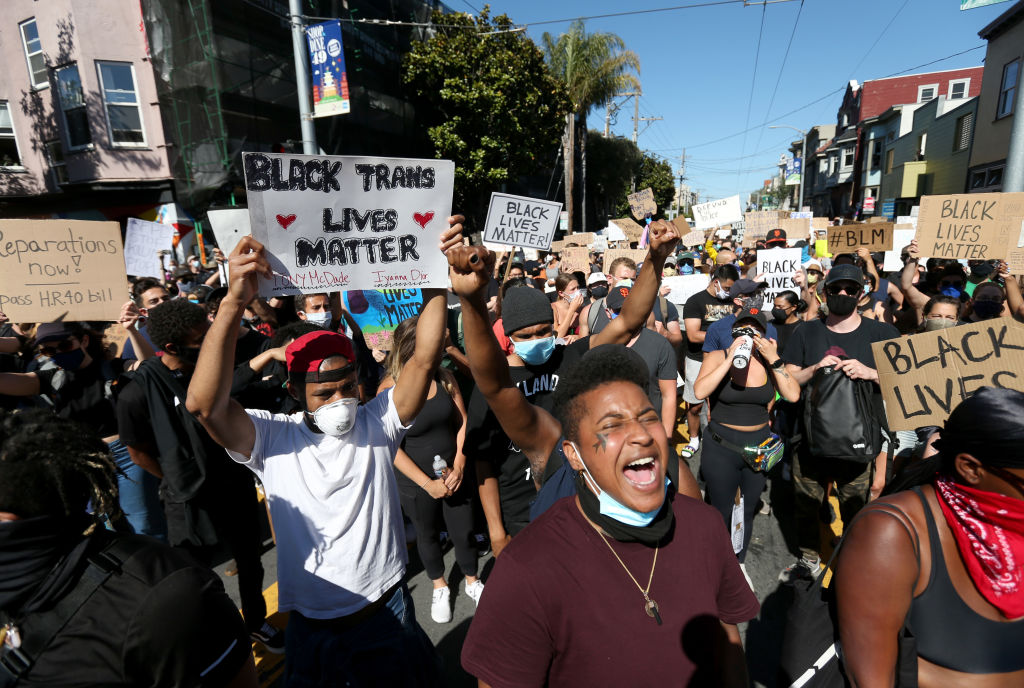 Protesters hold signs and chant during a demonstration to honor of George Floyd on June 3 in San Francisco, California. Thousands of of people came out to honor George Floyd who died after being held down by Derek Chauvin, a former member of the Minneapolis Police Department who has since been fired and charged with third degree murder. (Getty Images&mdash;Justin Sullivan/Getty Images)