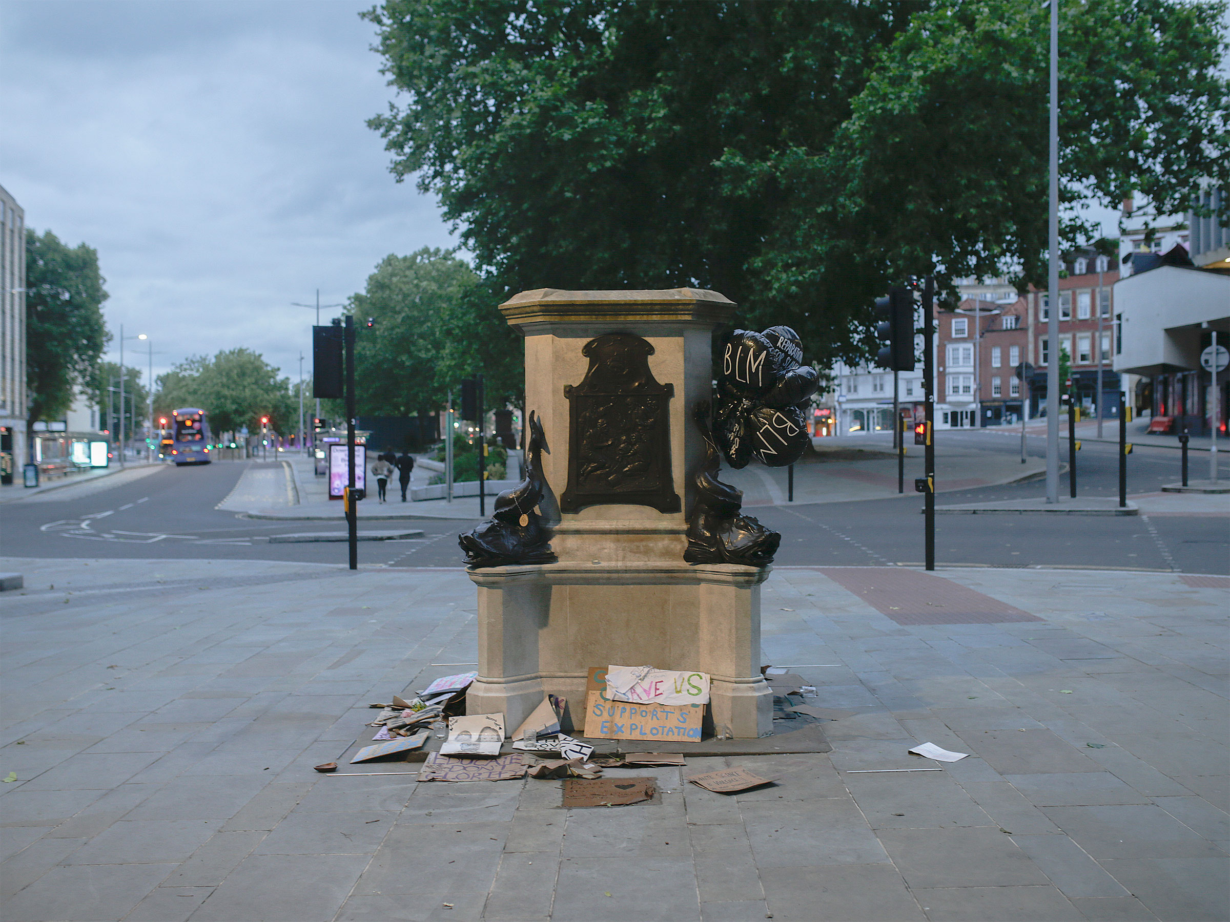 The plinth of the statue of Edward Colston in Bristol, England, is now surrounded by messages of support for the Black Lives Matter movement, June 11, 2020. (James Beck/The New York Times)