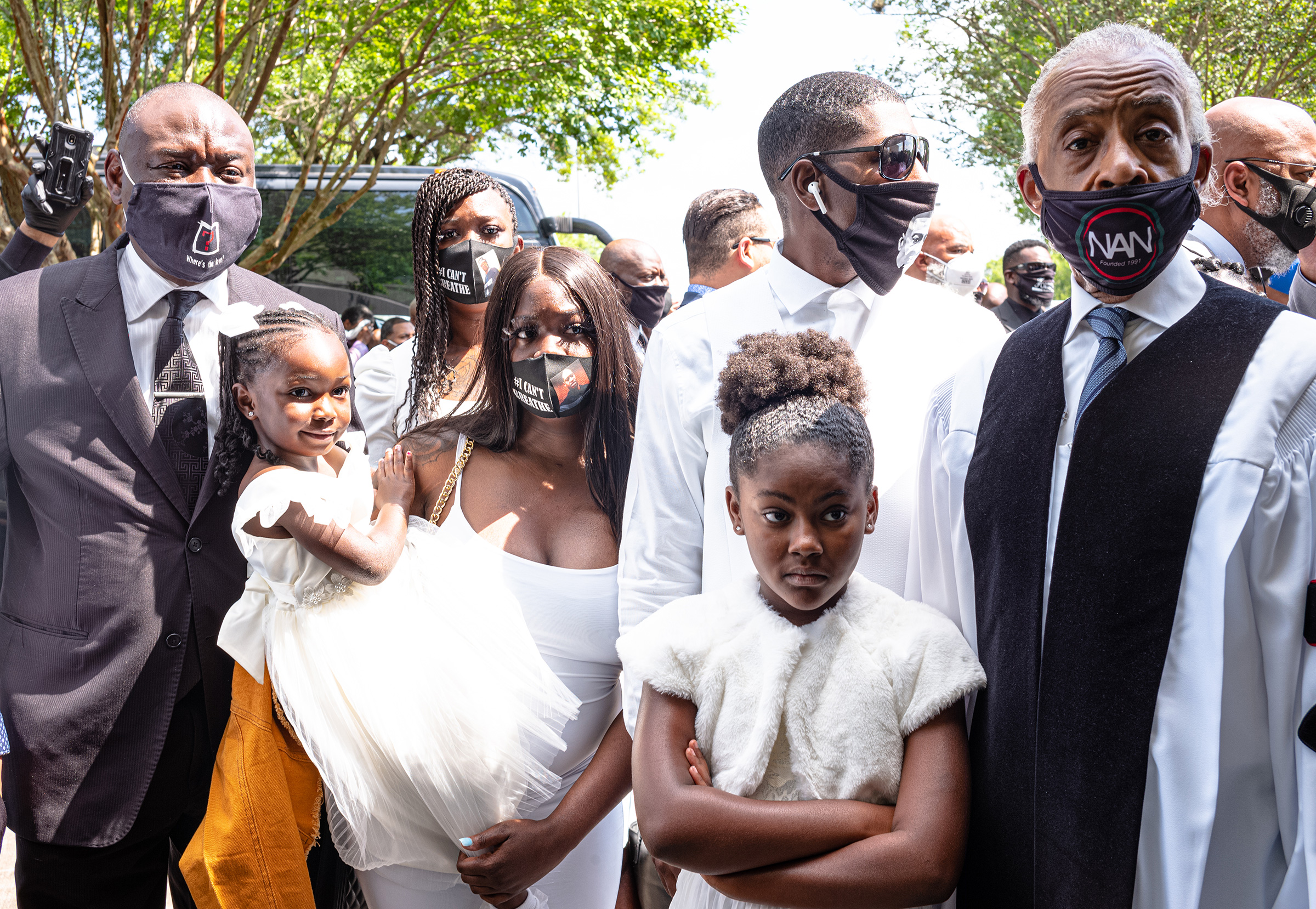 The family’s lawyer, Ben Crump, far left; Floyd’s son Quincy Mason, second from right, with his daughter in front of him; and the Rev. Al Sharpton, right, waiting for the private funeral on June 9. (Ruddy Roye for TIME)