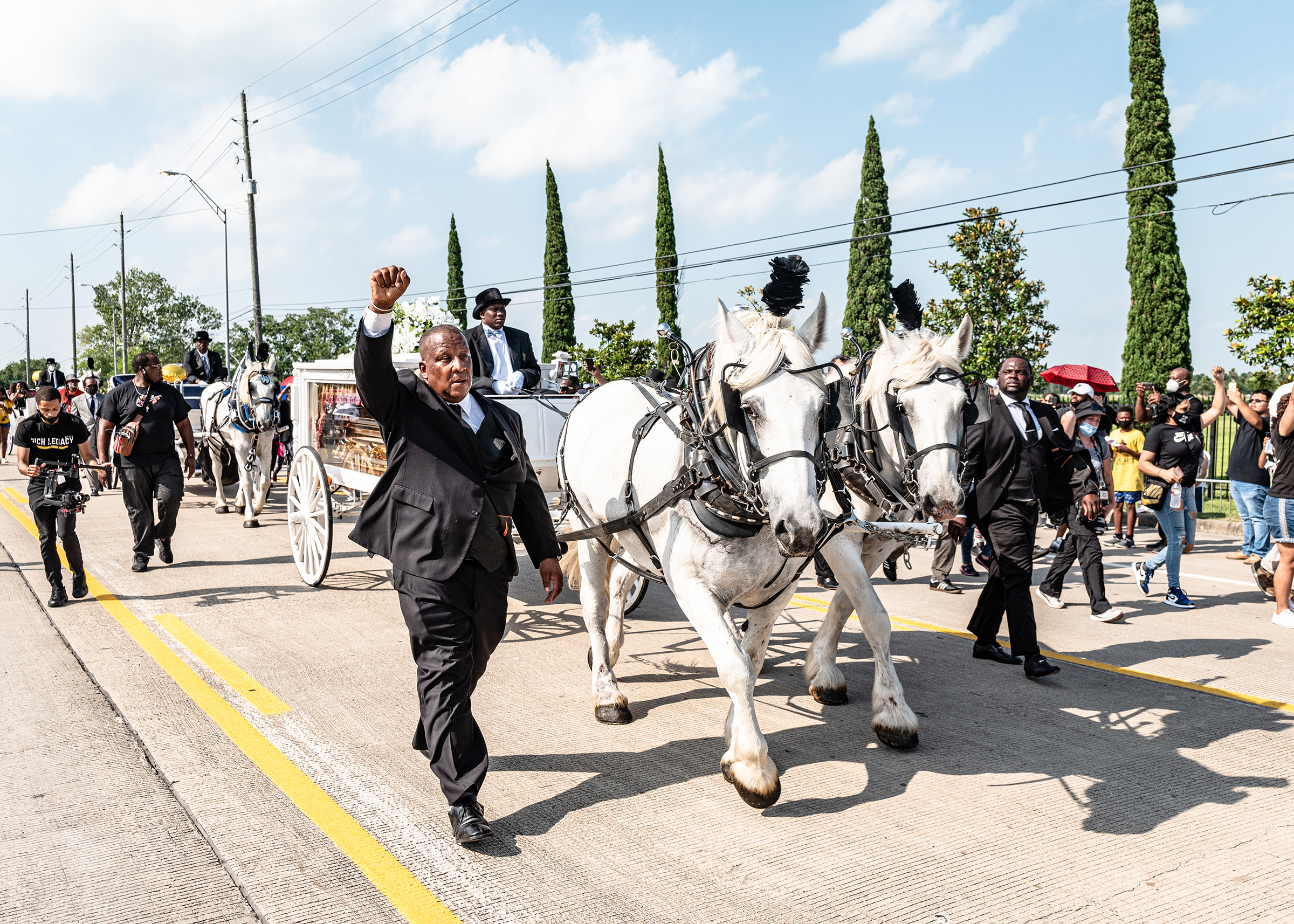 A horse-drawn carriage brought Floyd’s body into the cemetery on June 9. “It felt like a state funeral,” Roye said. “It felt like they were sending him off with the newfound persona that he had been catapulted into, and this was one of the ways to honor what he became. It felt right.” (Ruddy Roye for TIME)