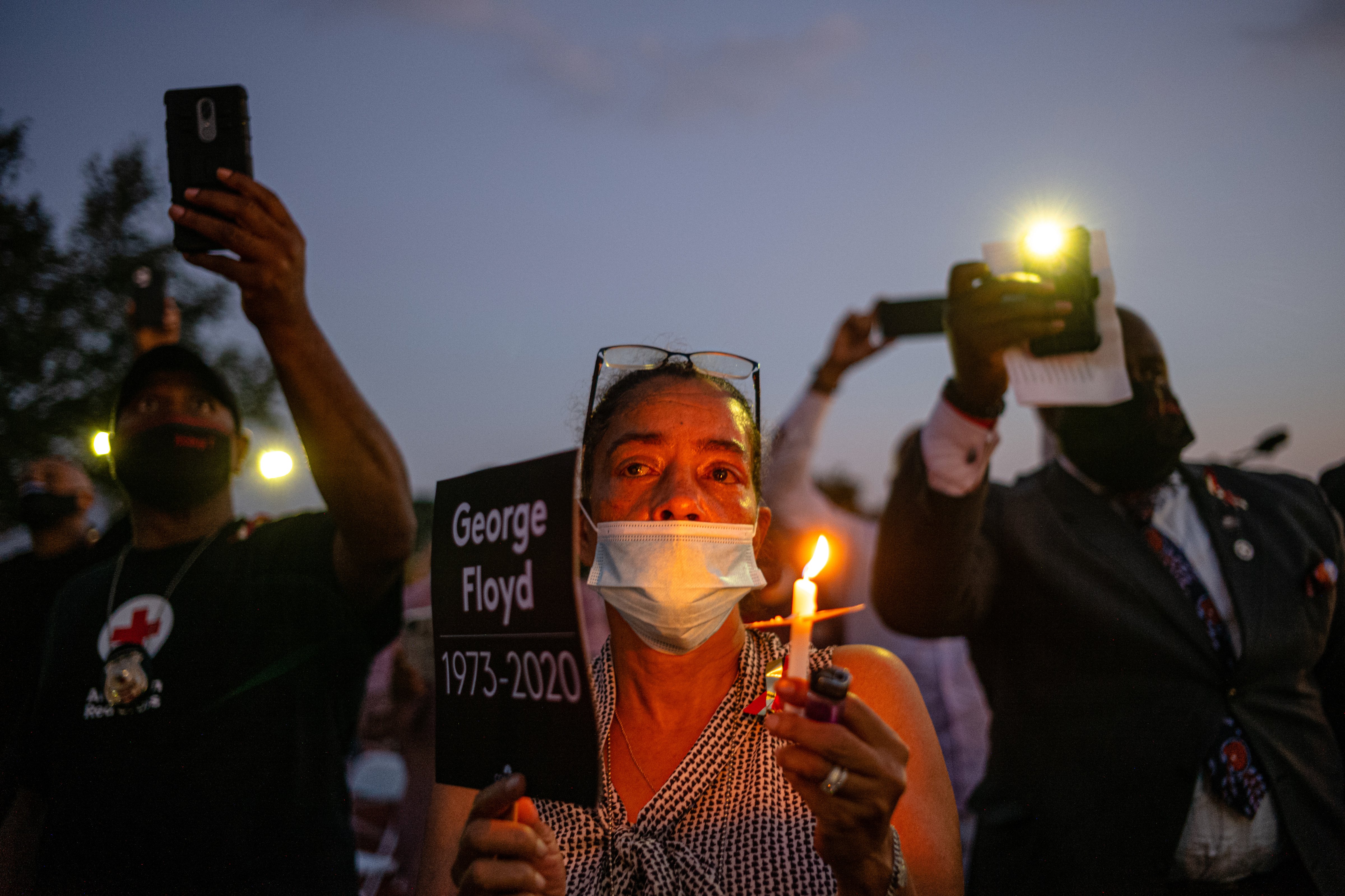 Attendees at a candlelight vigil honoring George Floyd at Jack Yates High School in Houston on June 8. (Ruddy Roye for TIME)