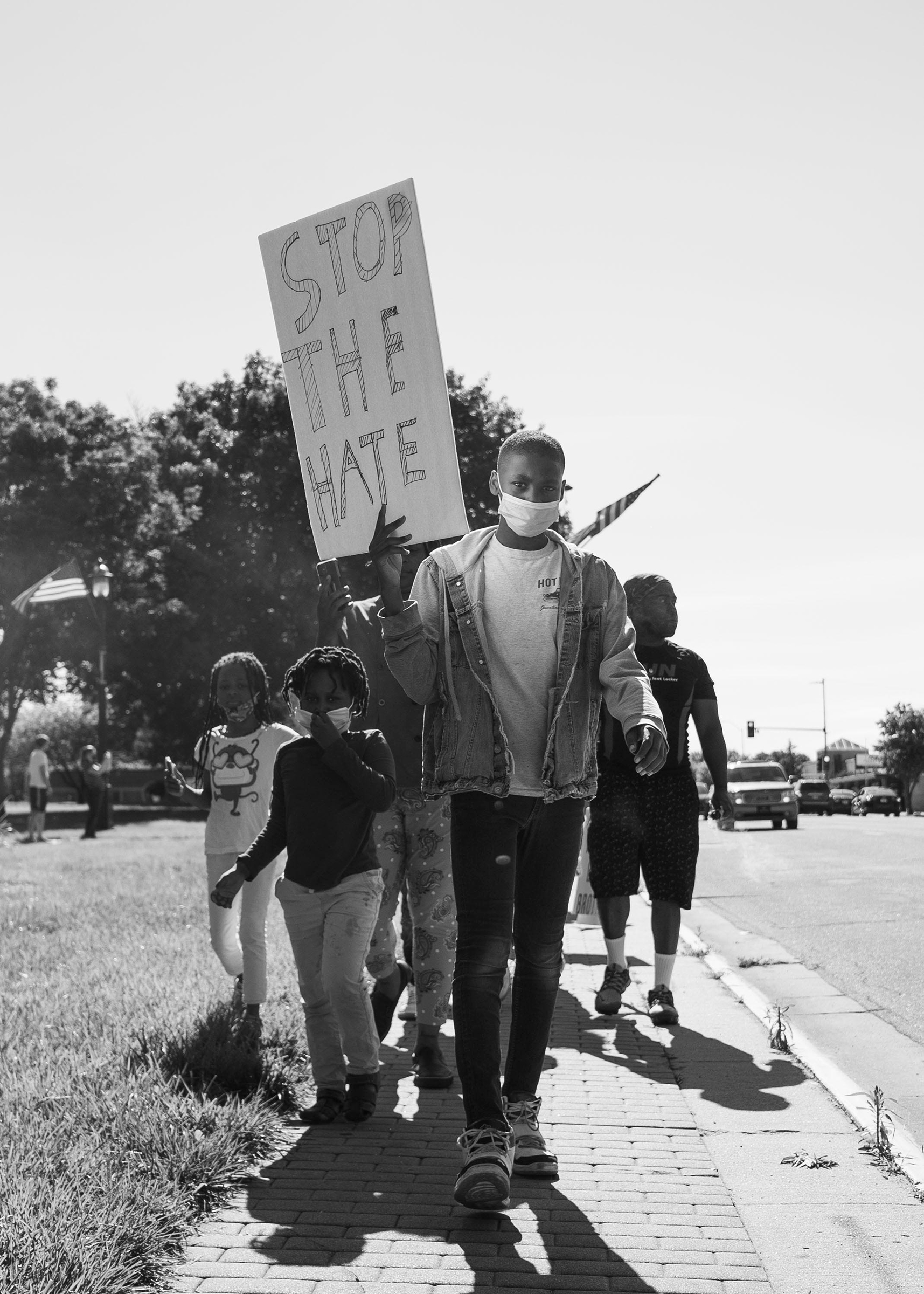Jason Allende, 13, walks before his mother and siblings, protesting the death of George Floyd in Junction City, Kans., May 29, 2020. (Doug Barrett)