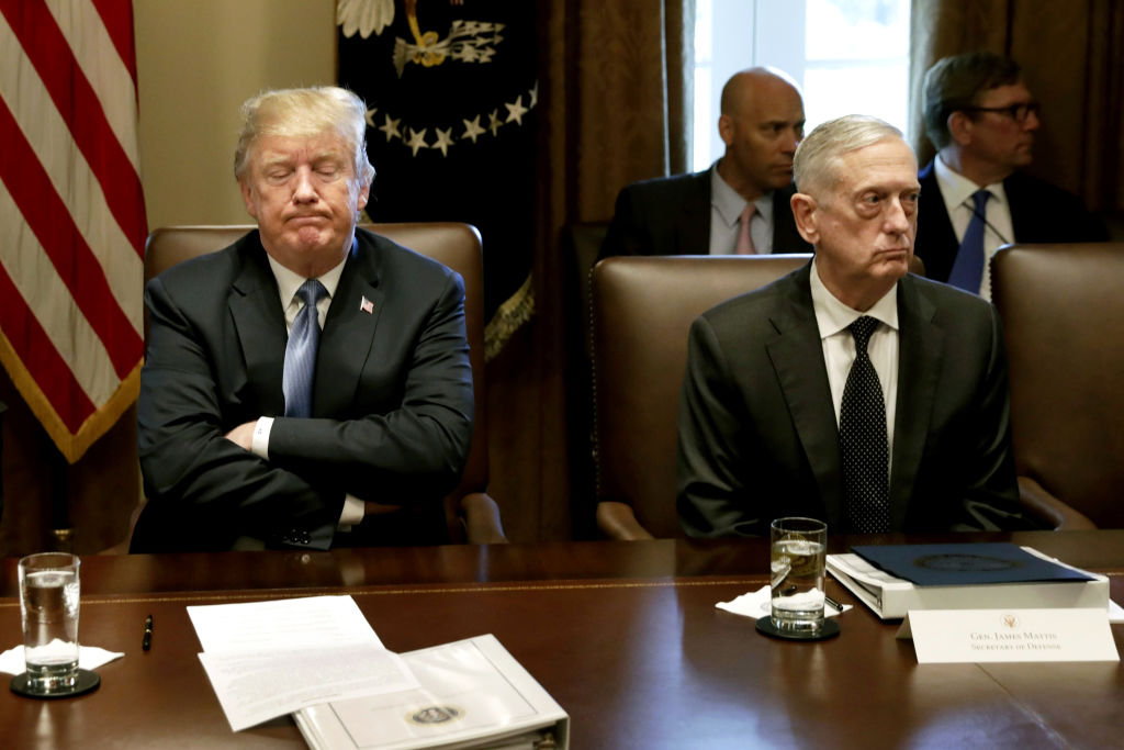 U.S. President Donald Trump, left, pauses while speaking as James Mattis, then U.S. Secretary of Defense, listens during a Cabinet meeting at the White House in Washington, D.C., U.S., on June 21, 2018. (Yuri Gripas—Bloomberg/Getty Images)