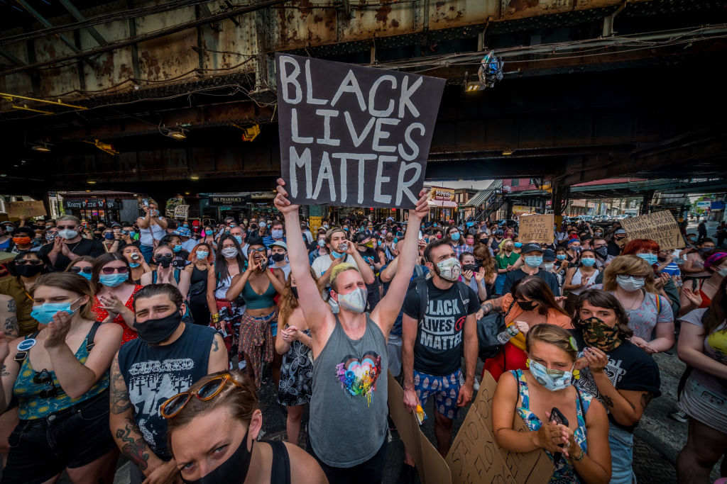 A participant holding a Black Lives Matter sign at a protest in Brooklyn, N.Y., on June 6, 2020. (Erik McGregor—LightRocket via Getty Images)