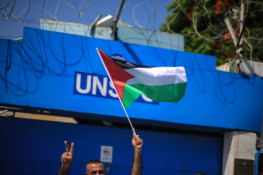 People gather to stage a protest against Israel's annexation plan of Jordan Valley, located in the occupied West Bank, outside the Office of the United Nations Special Coordinator for the Middle East Peace Process (UNSCO) in Gaza City, Gaza on June 29, 2020 (Ali Jadallah—Anadolu Agency via Getty Images)