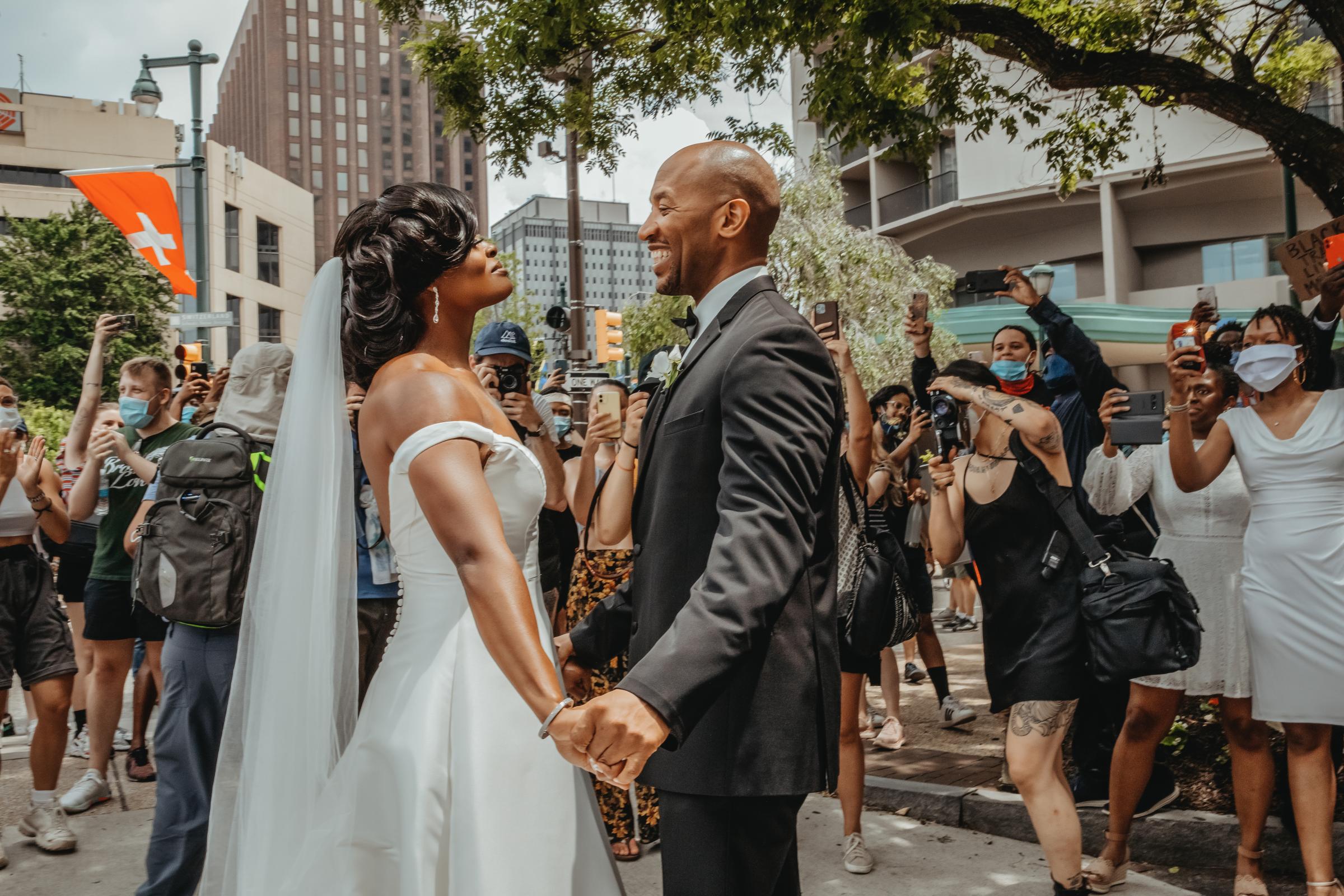 Kerry Anne and Michael Gordon join a Black Lives Matter protest taking place alongside their wedding ceremony at The Logan hotel in Philadelphia on June 6, 2020.