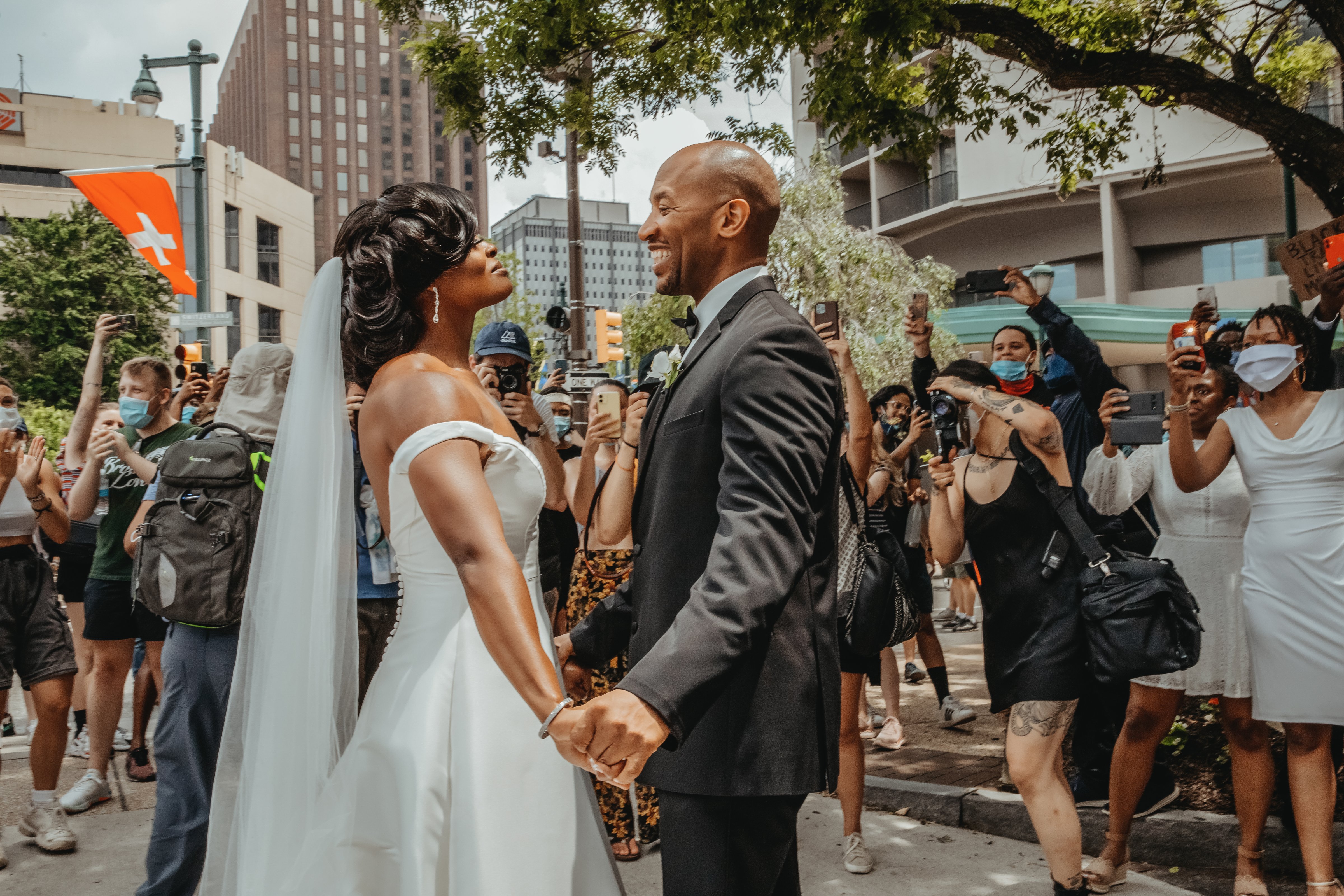 Dr. Kerry Anne Perkins and Michael Gordon join a Black Lives Matter protest taking place alongside their wedding ceremony at The Logan hotel in Philadelphia on June 6, 2020. (Linda McQueen—Linda McQueen Photography)