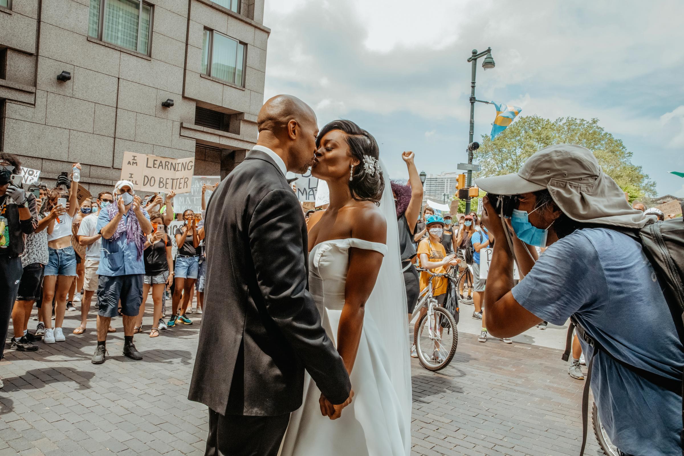 Dr. Kerry Anne Perkins and Michael Gordon join a Black Lives Matter protest taking place alongside their wedding ceremony at The Logan hotel in Philadelphia on June 6, 2020.