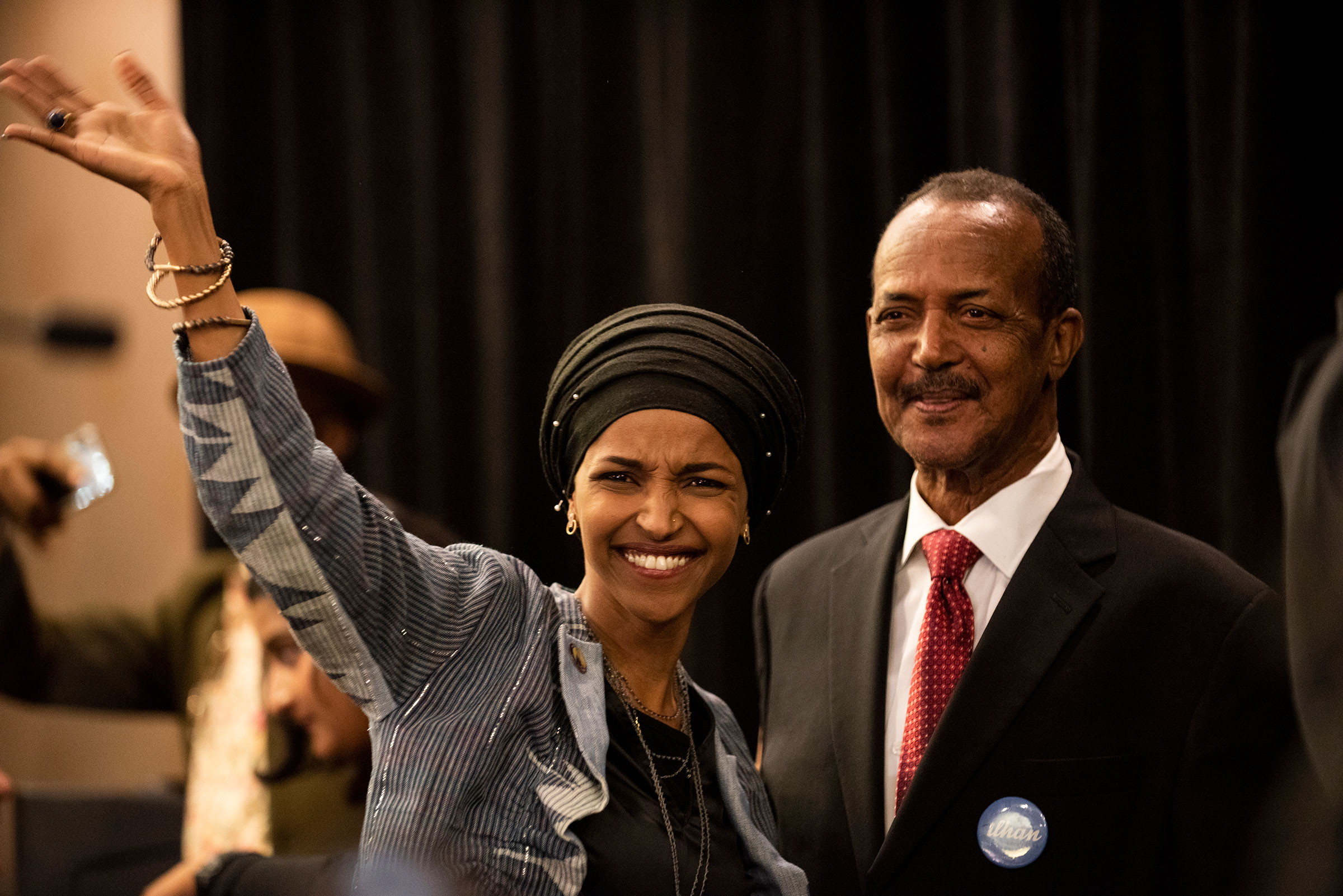 Rep. Ilhan Omar and her father Nur Omar Mohamed at an election night results party in Minneapolis on Nov. 6, 2018. (Stephen Maturen—Getty Images)