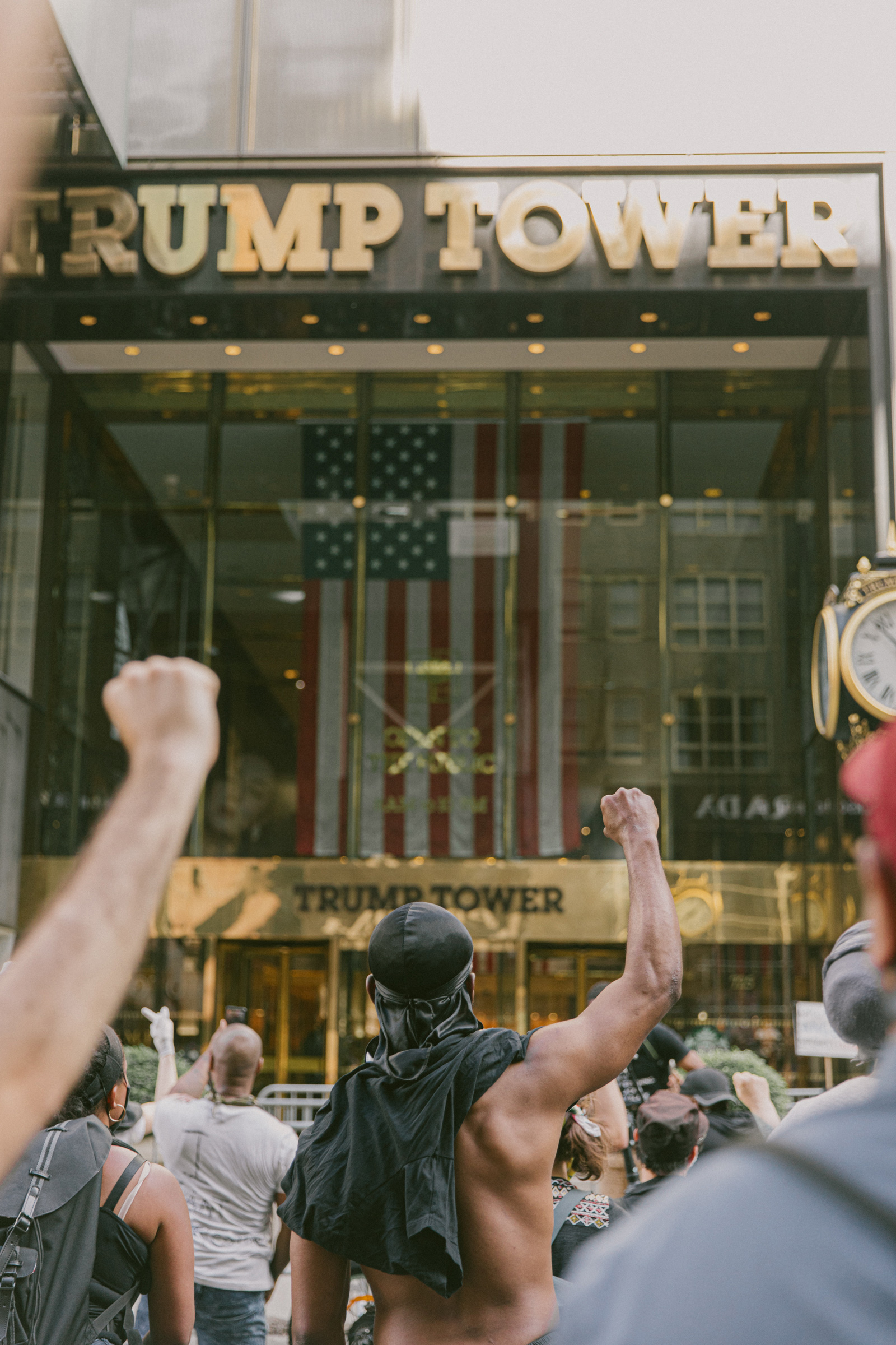 Protestors marching down 5th Avenue stop and stand before Trump Tower in New York City, May 30, 2020.