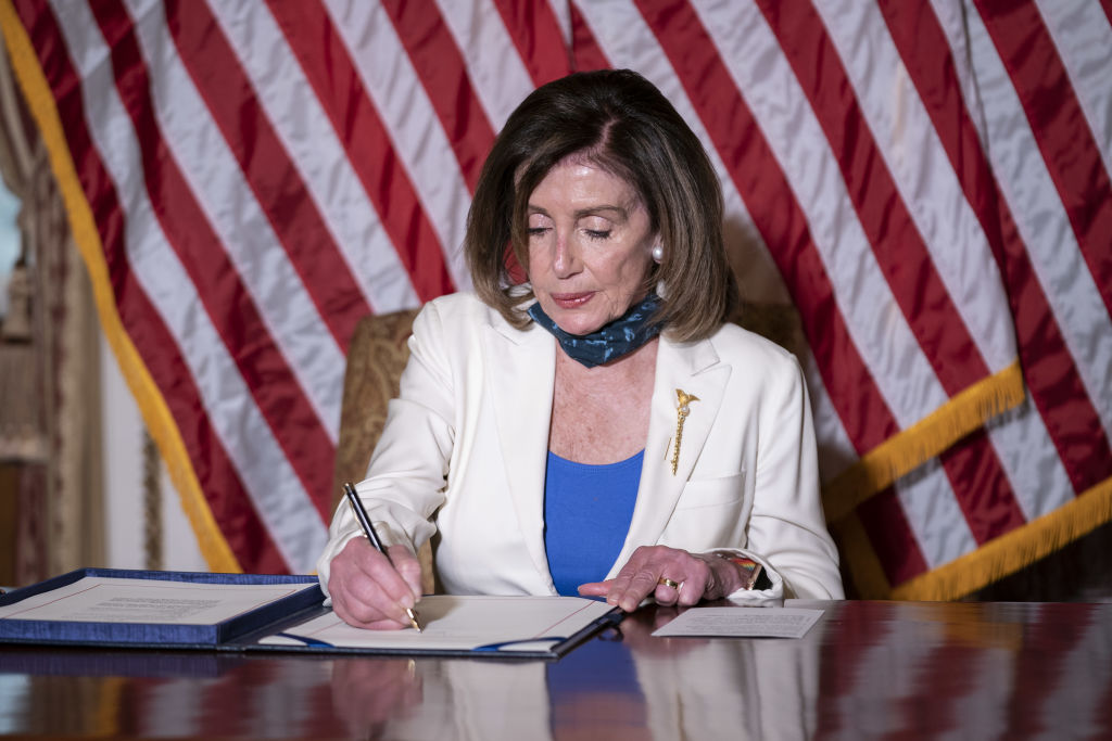 House Speaker Pelosi Holds Bill Enrollment Ceremony For Uyghur Human Rights Policy Act