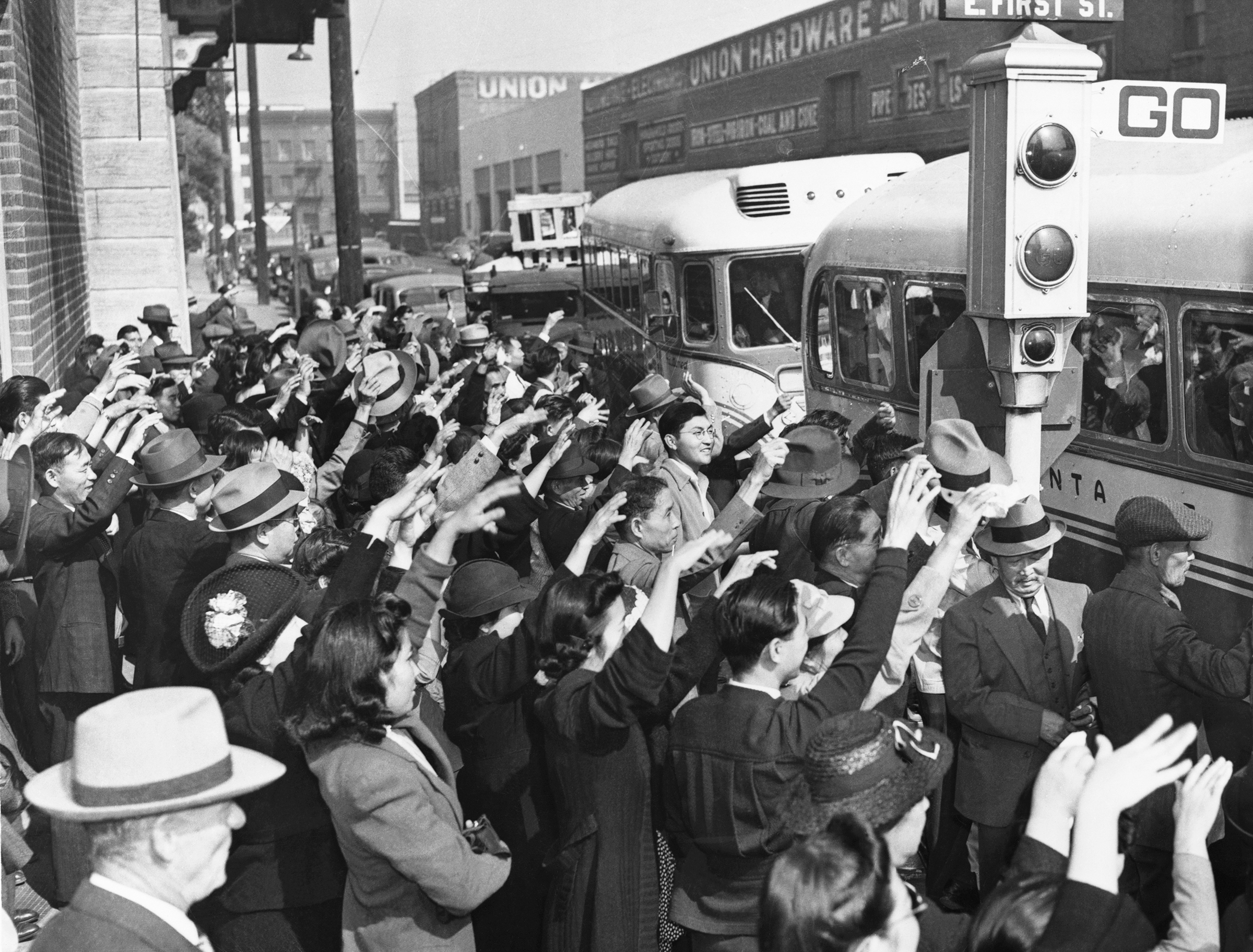 Japanese-American residents of Los Angeles wave a farewell to relatives and friends who are being deported to Japan in October 1941. (Hulton-Deutsch Collection/Corbis/Getty Images)
