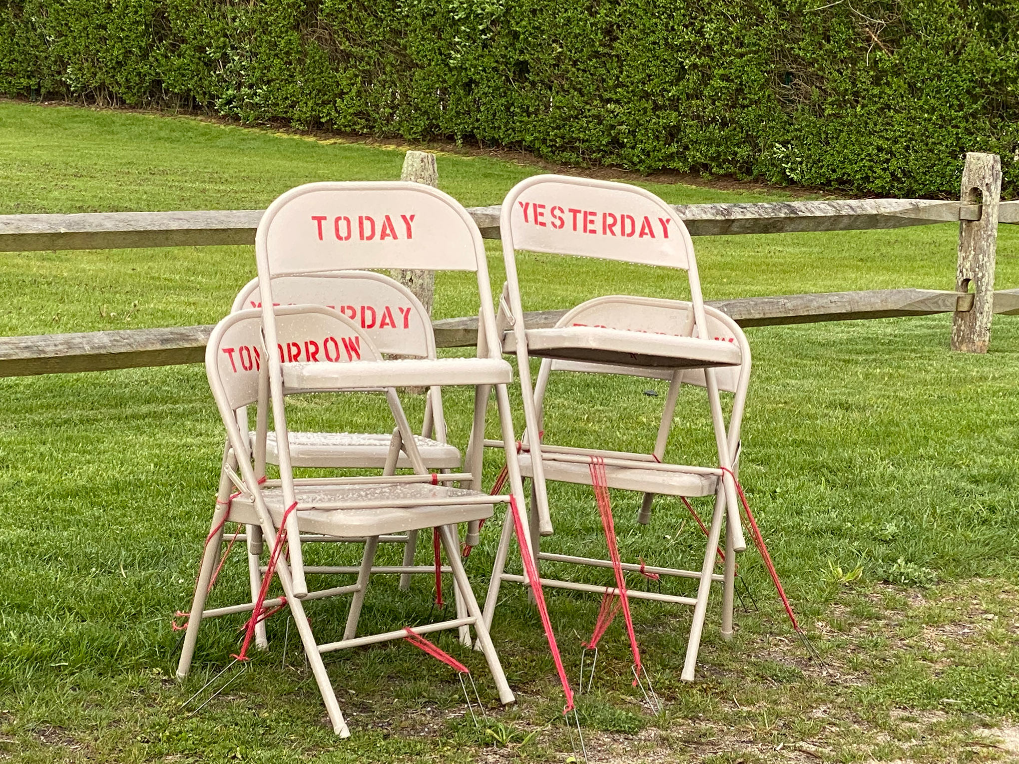 In a “Drive-by-Art” show in New York, Toni Ross and Sara Salaway exhibited When, a social-­isolation “calendar” of jumbled chairs with date-related words (Courtesy of Toni Ross and Sara Salaway)