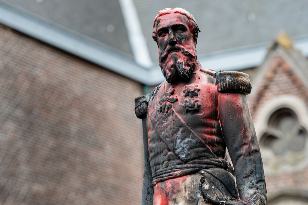 A statue of King Leopold II of Belgium is pictured on June 4, 2020 in Antwerp after being set on fire the night before as a petition was launched on June 1 to remove all statues in honor of this colonial-era King from the City of Brussels amidst worldwide anti-racist protests. (Jonas Roosens/Belga/AFP via Getty Images)
