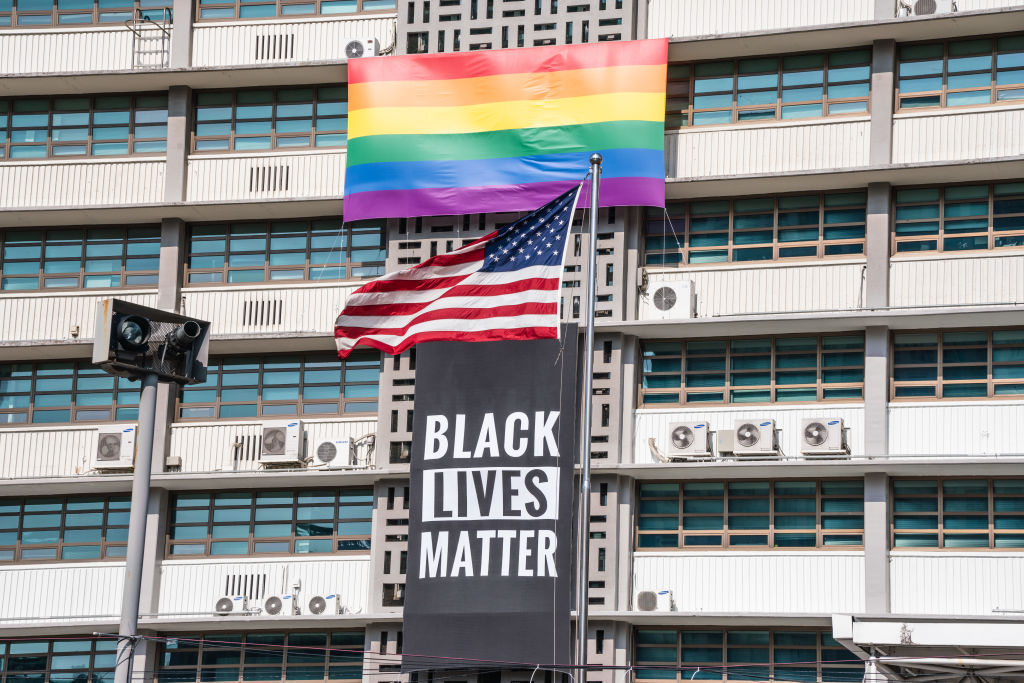 A Black Lives Matter banner, a United States national flag