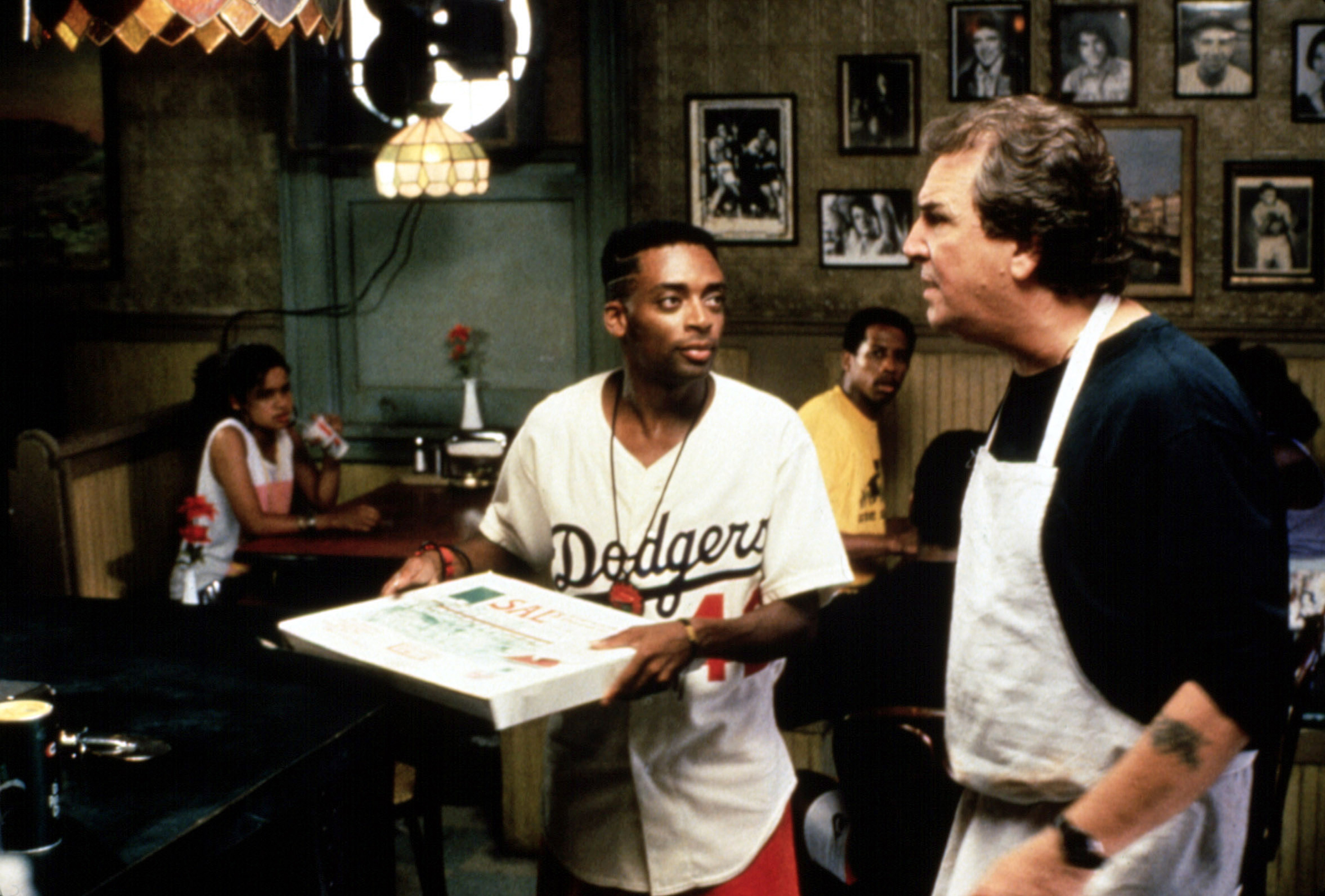Spike Lee (center) and Danny Aiello (right) in Do the Right Thing, 1989 (Universal/Everett Collection)