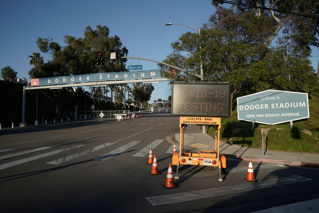 A "Covid-19 Testing" sign stands outside Dodger Stadium in Los Angeles, California, U.S., on Wednesday, May 27, 2020. (Bing Guan — Bloomberg/Getty Images)