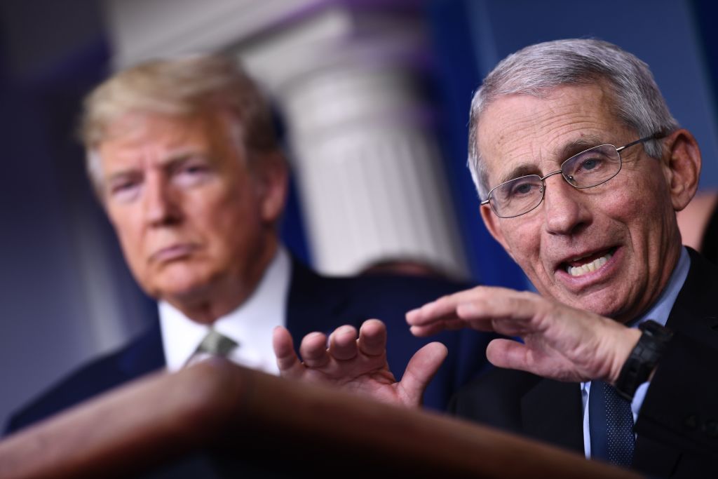 Dr. Anthony Fauci speaks as US President Donald Trump listens during the daily press briefing on the Coronavirus pandemic situation at the White House on March 17, 2020 in Washington, DC. (BRENDAN SMIALOWSKI/AFP—Getty Images)