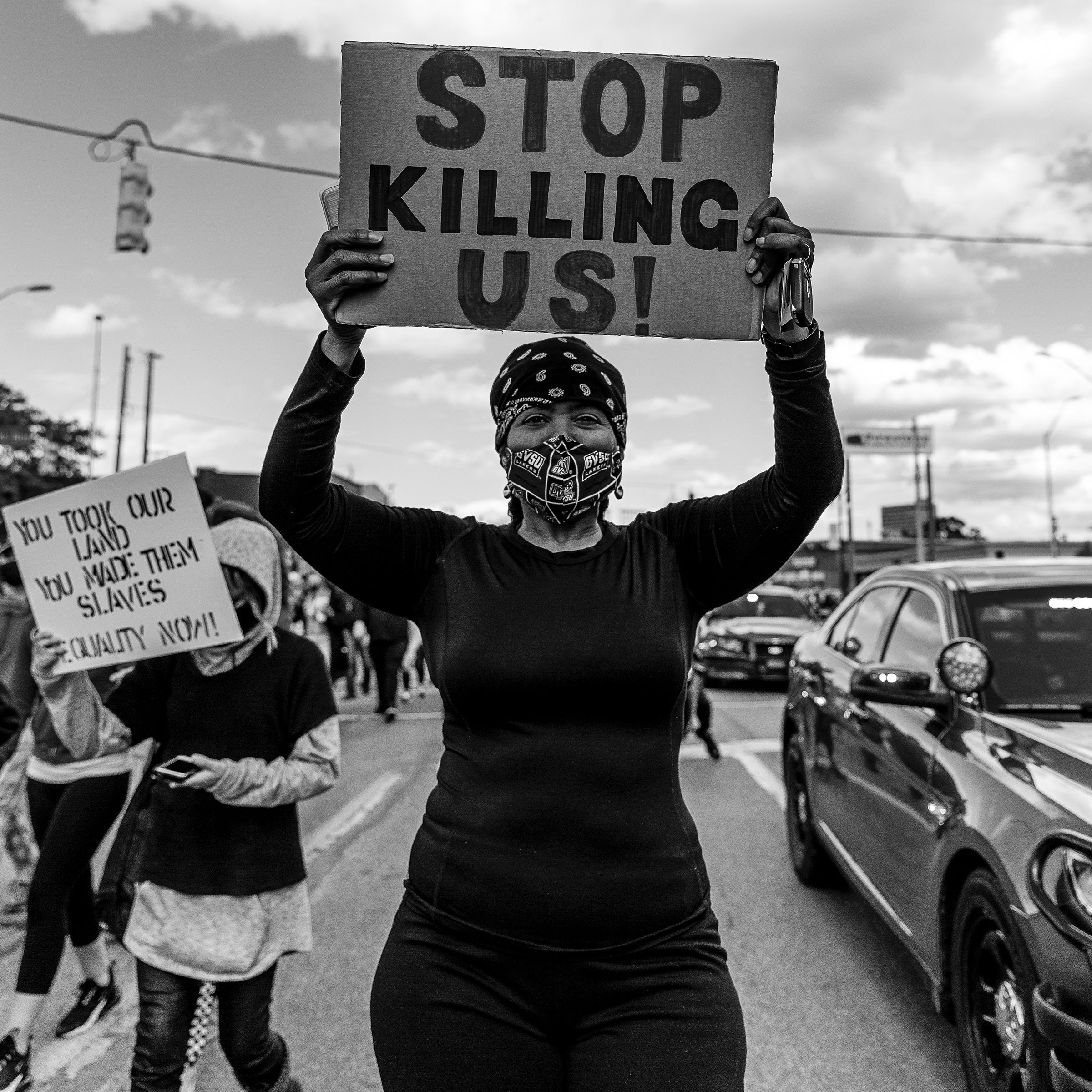 Stacey Graham of Detroit holds her sign while marching down Michigan Ave. during the second consecutive day of protests against the death in Minneapolis police custody of African-American man George Floyd on Saturday, May 30, 2020 in Detroit, Mich. On Friday night, protests escalated resulting in dozens of arrests and a shooting death of a 21-year old man. “We’re just so tired, we’re exhausted. I have a son and grandson fear for them all the time,” she said. “That’s no way to live…to live in fear.”