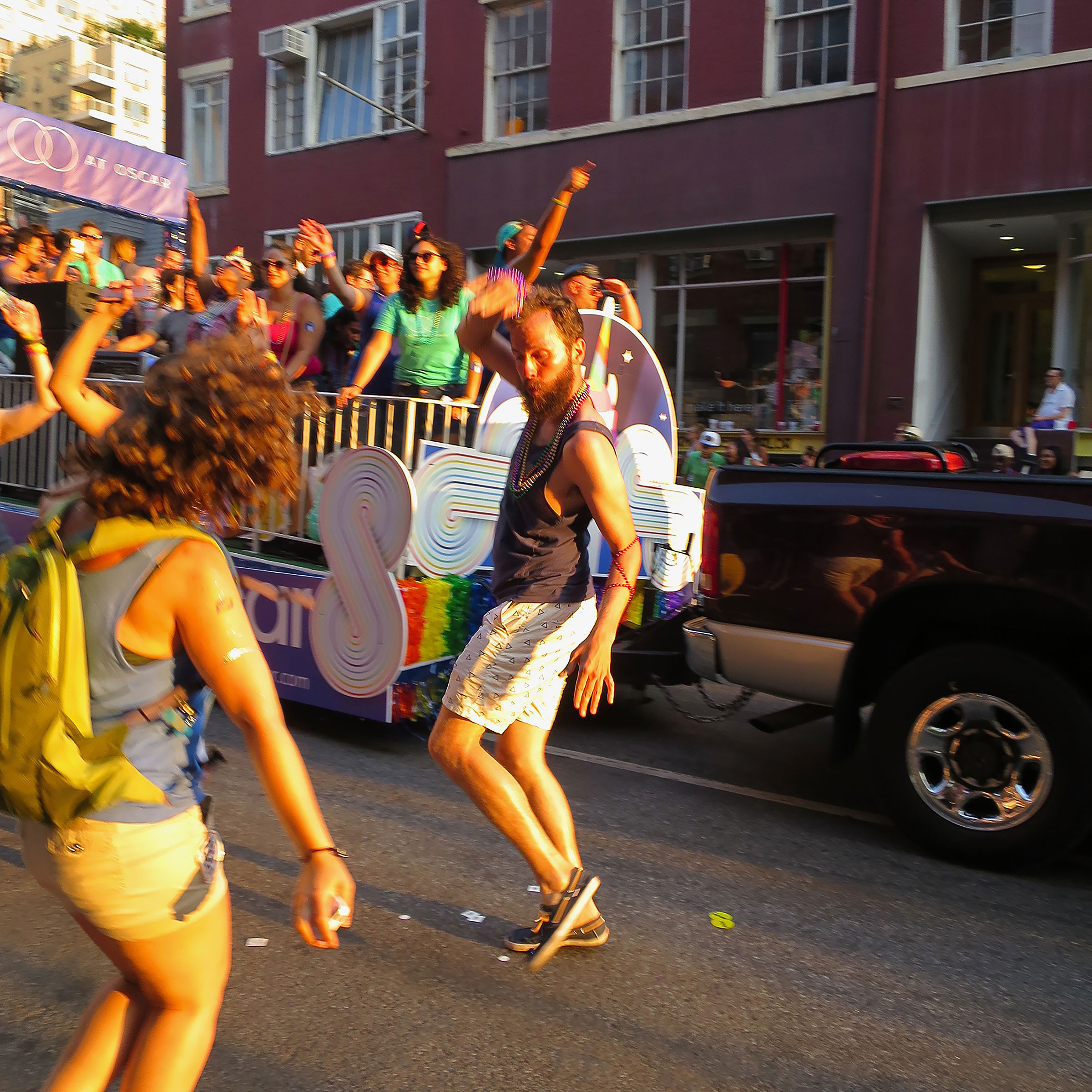 Ginger guy dancing on 8th Street, late afternoon PRIDE