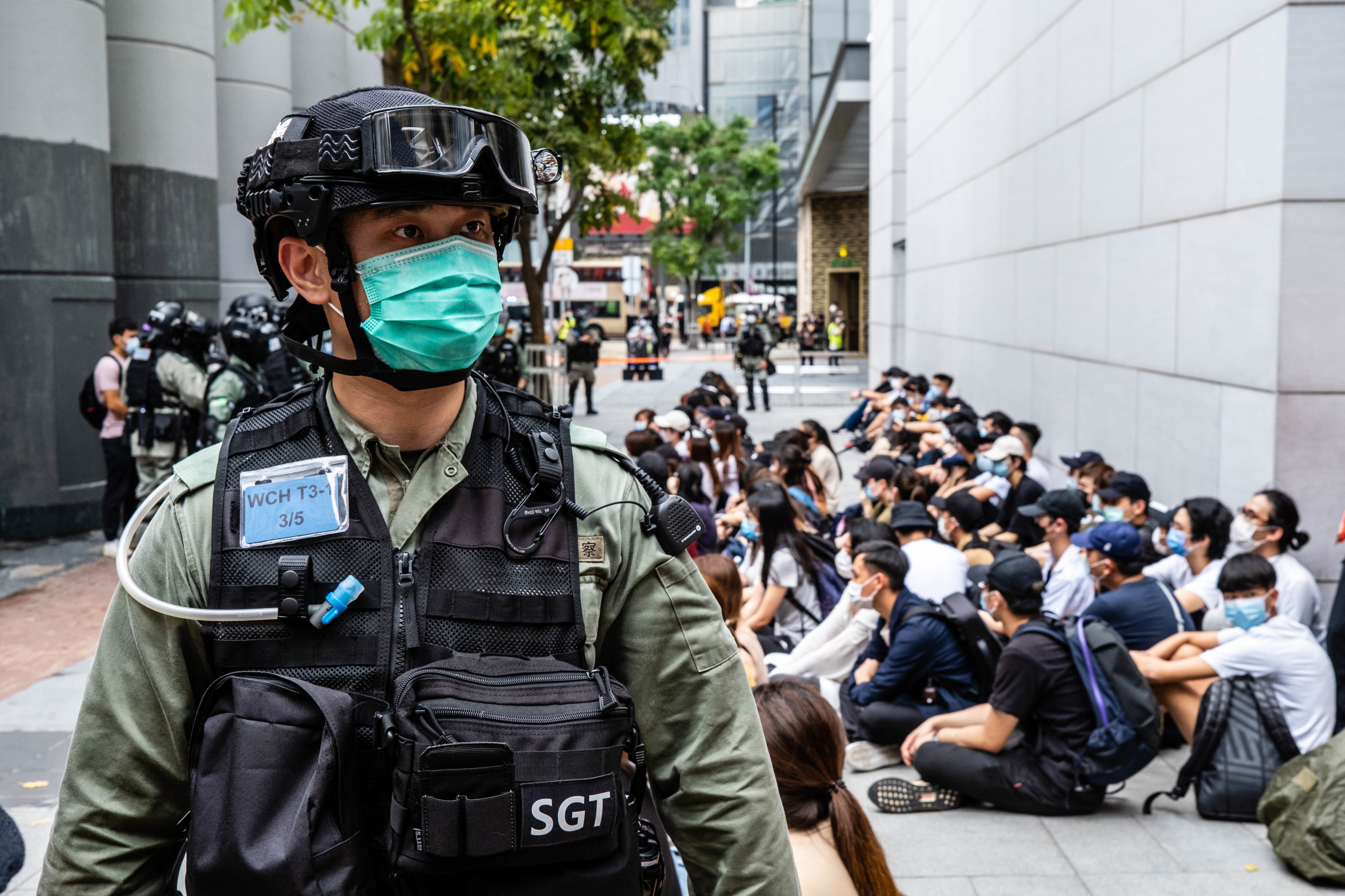 Riot police round up a group of protesters during the a demonstration against a law criminalizing insulting the Chinese national anthem, on May 27, 2020 in Hong Kong. (Willie Siau—SOPA Images/LightRocket/Getty Images)