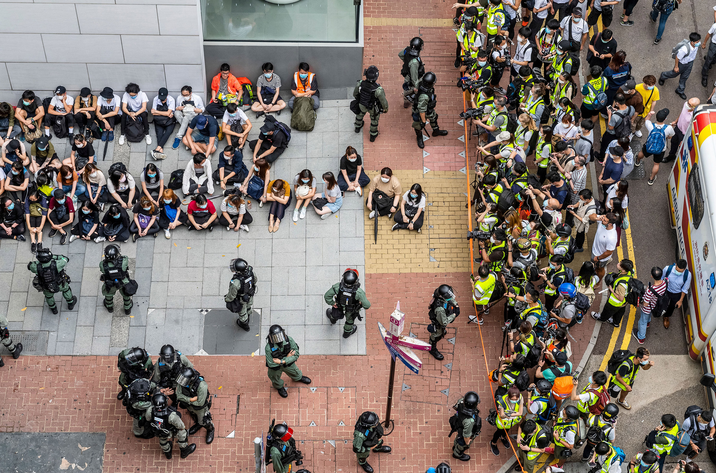 Police circle detainees near the city’s legislature on May 27, as the debate over the national-security bill was set to resume (Miguel Candela—EPA-EFE/Shutterstock)