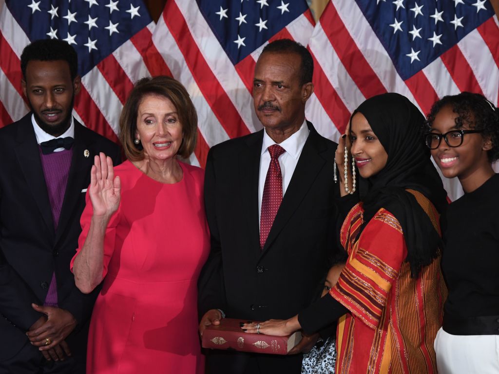 Speaker of the House Nancy Pelosi performs a ceremonial swearing-in for US House Representative Ilhan Omar at the start of the 116th Congress at the US Capitol in Washington, DC, January 3, 2019. (Saul Loeb/AFP—Getty Images)