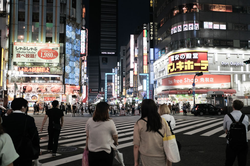 Pedestrians wait to cross a street in the Shinjuku district of Tokyo, Japan, on June 14, 2020. (Soichiro Koriyama&mdash;Bloomberg/Getty Images)