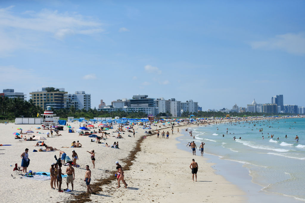 Beachgoers take advantage of the opening of South Beach on June 10, 2020 in Miami Beach, Florida. (Cliff Hawkins/Getty Images)