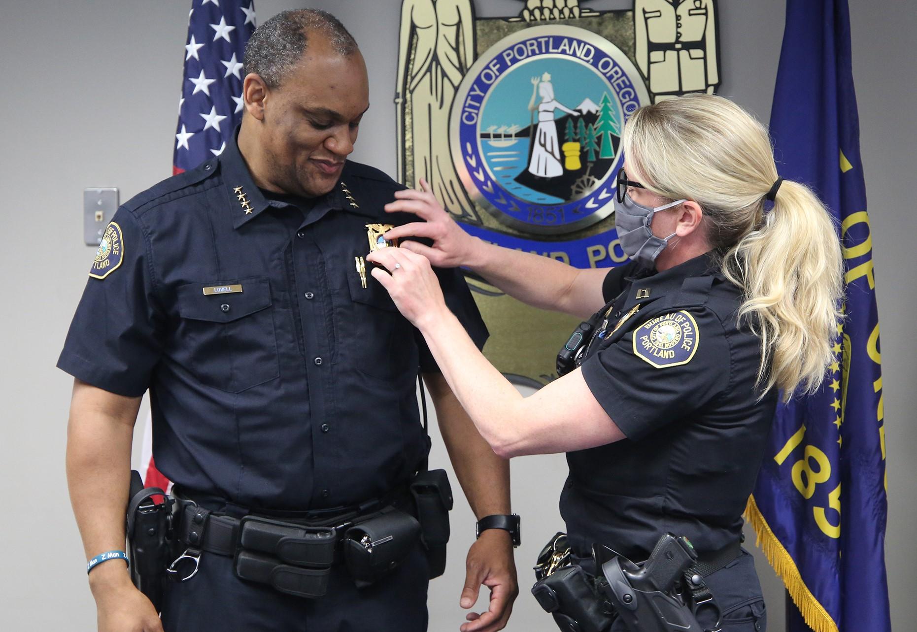 Chuck Lovell (left) is sworn in as Portland Police Bureau Chief on  June 11, 2020. He replaces former chief Jami Resch (right). (Photo courtesy Portland Police Bureau)