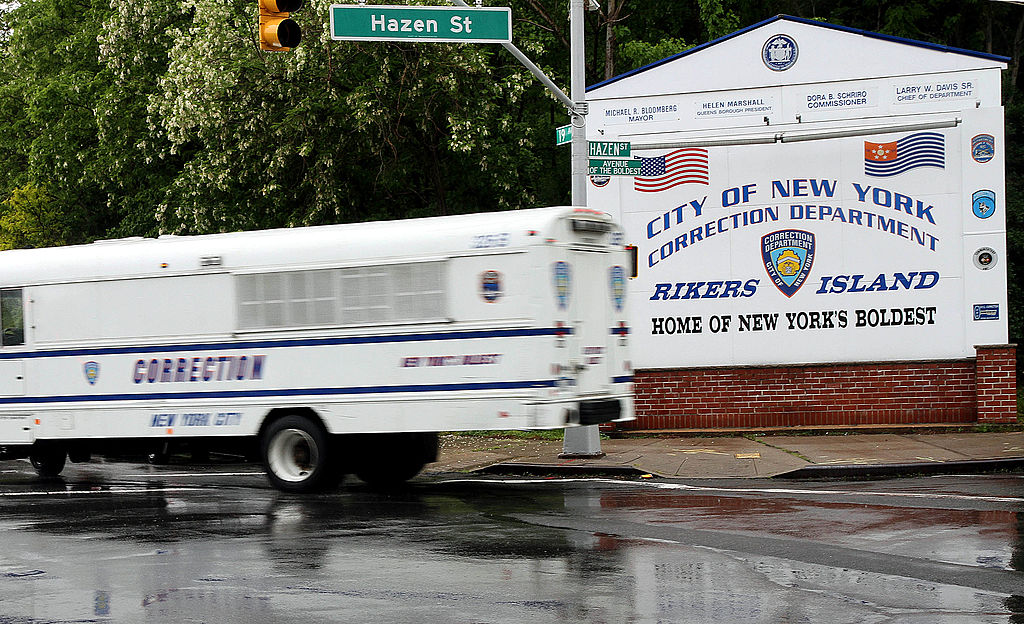 A New York City Corrections bus turns off of the Rikers Island entry road in New York, U.S., on Friday, May 20, 2011. (Rick Maiman—Bloomberg/Getty Images)