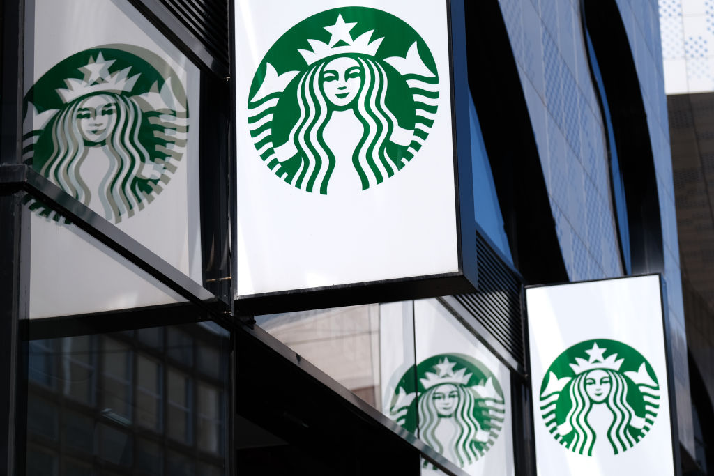 The Starbucks logo is reflected on a window outside the coffee chain's store on June 24, 2020 in The Hague, Netherlands. (Yuriko Nakao/Getty Images)