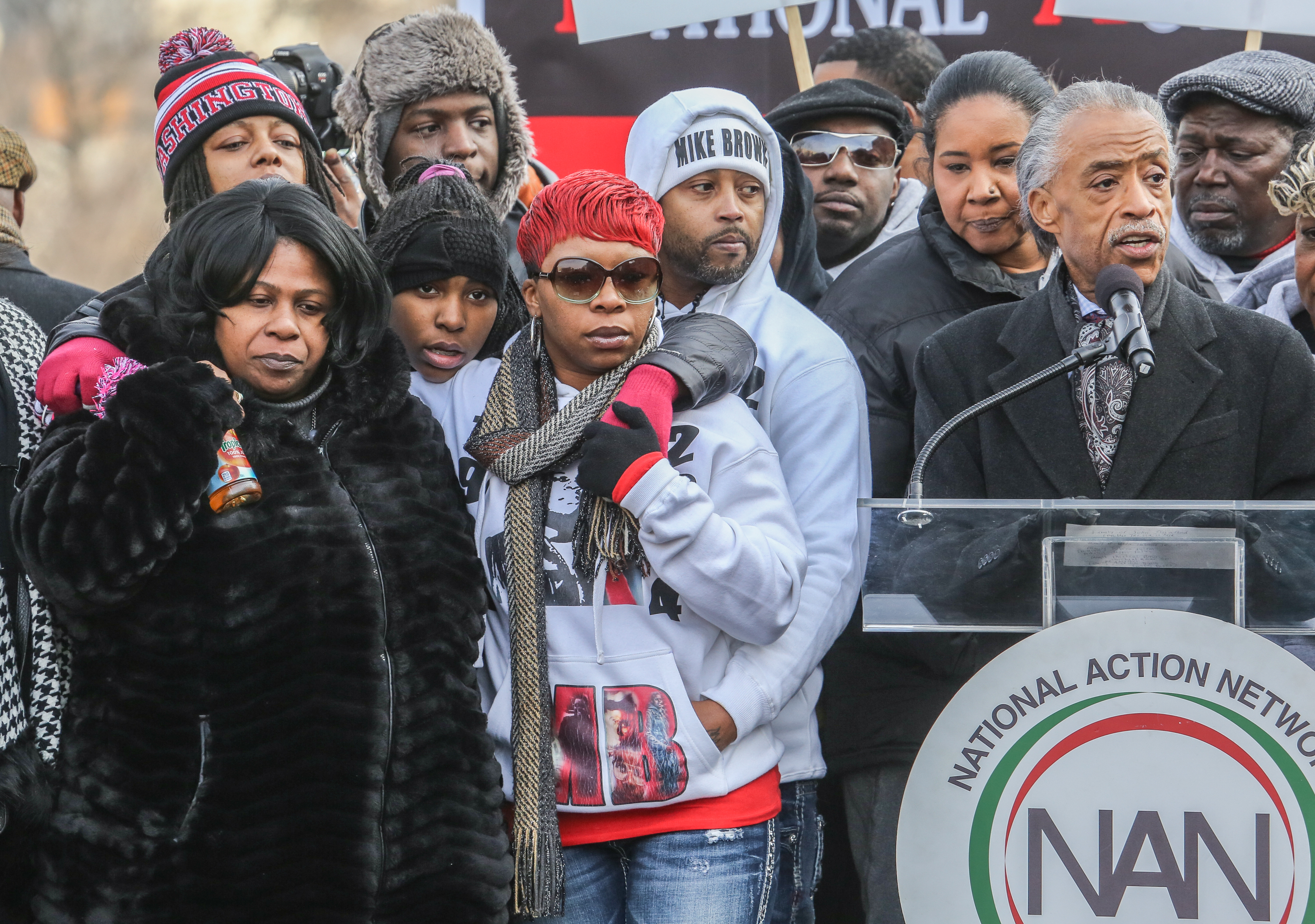 Samaria Rice (left), the mother of Tamir Rice, and Leslie McSpadden (right), the mother of Michael Brown, listen to Al Sharpton, at a march in Washington, D.C., on December 13, 2014. (Evelyn Hockstein/Washington Post—Getty Images)
