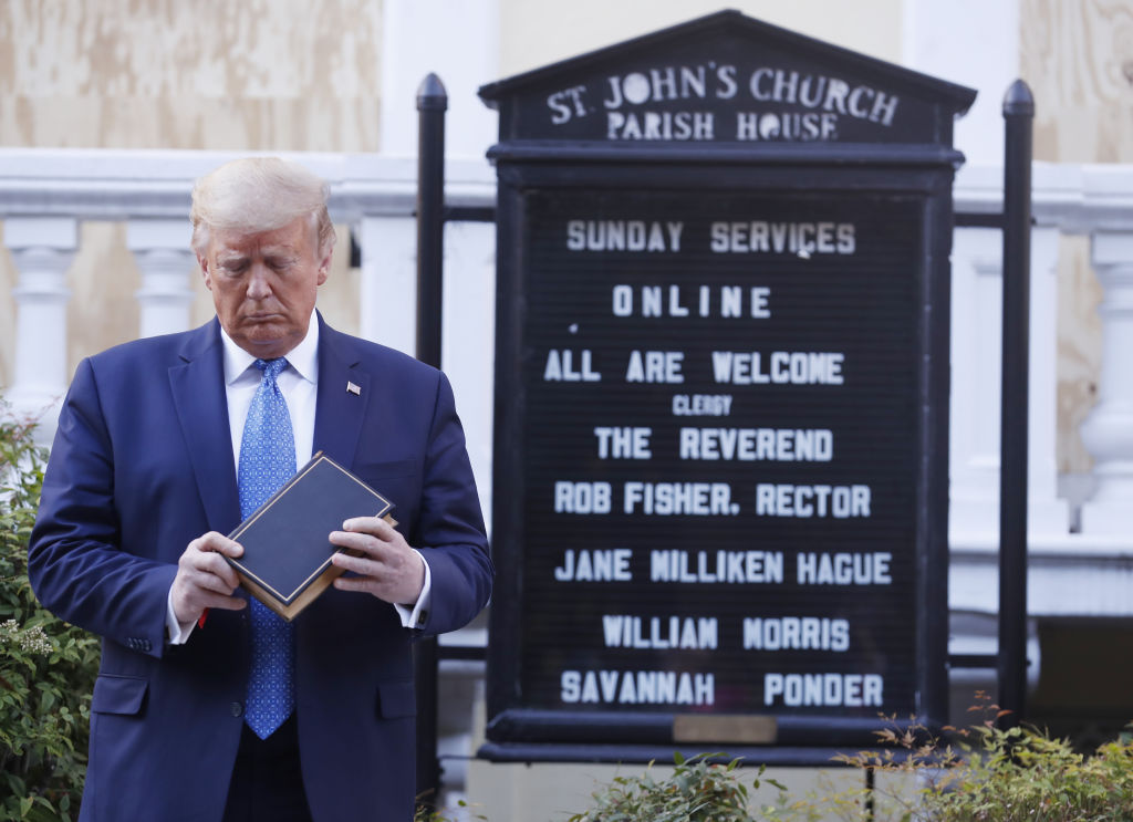 President Donald Trump poses with a bible outside St. John's Episcopal Church after a news conference in the Rose Garden of the White House in Washington, D.C., U.S., on Monday, June 1, 2020.