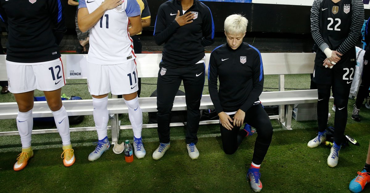 Womens soccer kneeling