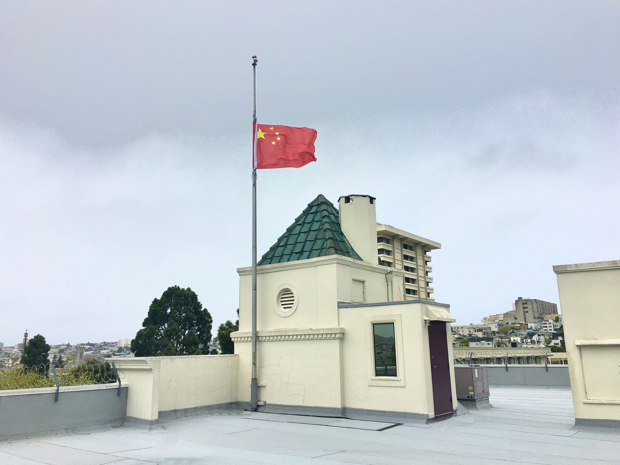 A Chinese national flag flies at half-mast to mourn for people who died in the fight against COVID-19 at the Consulate-General of the People's Republic of China in San Francisco on April 4, 2020. (Chinese Embassy to U.S./Handout/Xinhua/SIPA)