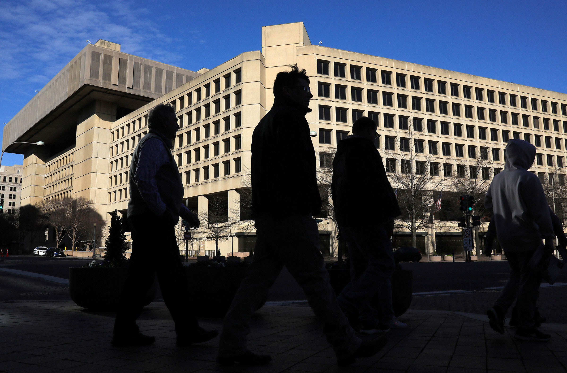 People walking by the FBI Headquarters in Washington