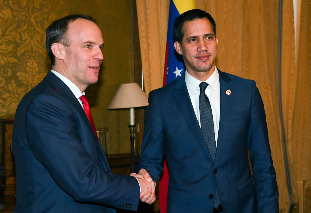 Venezuela's Opposition leader Juan Guaido (R) shakes hands with British Foreign Secretary Dominic Raab at The Foreign &amp; Commonwealth Office on January 21, 2020 in London, England. (Alberto Pezzali —WPA Pool via Getty Images)