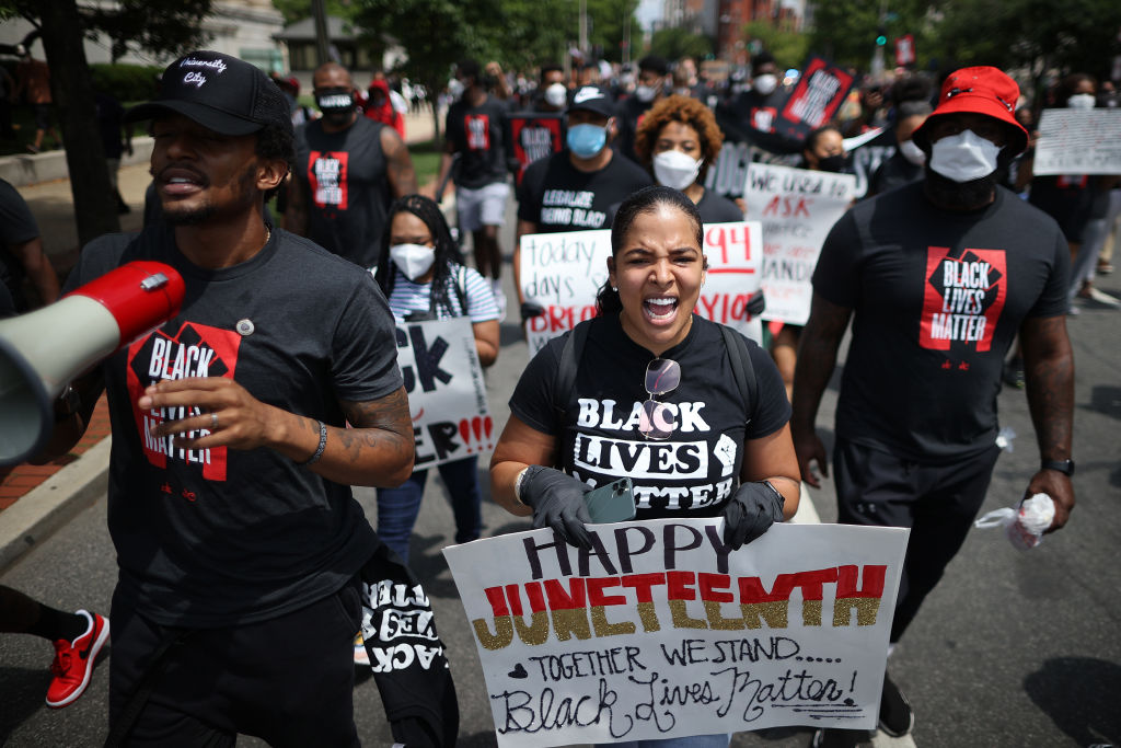 Members of the Washington Wizards and Washington Mystics basketball teams march to the MLK Memorial to support Black Lives Matter and mark the Juneteenth holiday June 19, 2020 in Washington, D.C. (Chip Somodevilla—Getty Images)