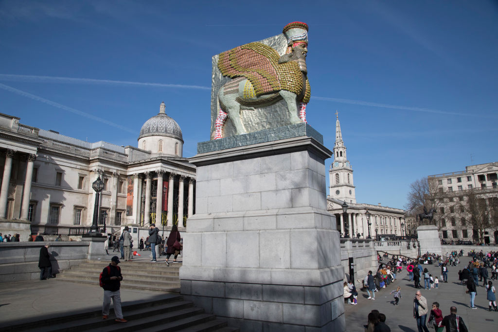 The Fourth Plinth sculpture "The Invisible Enemy Should Not Exist" by artist Michael Rakowitz in London on April 5, 2018. The artwork attempts to recreate more than 7,000 objects which have been lost forever. Some were looted from the Iraq Museum in 2003, while others were destroyed at archaeological sites across the country during the Iraq War. Rakowitz recreated the Lamassu, a winged bull and protective deity guarded the entrance to Nergal Gate of Nineveh from 700 BC until it was destroyed in 2015. (Mike Kemp/In Pictures—Getty Images Images)