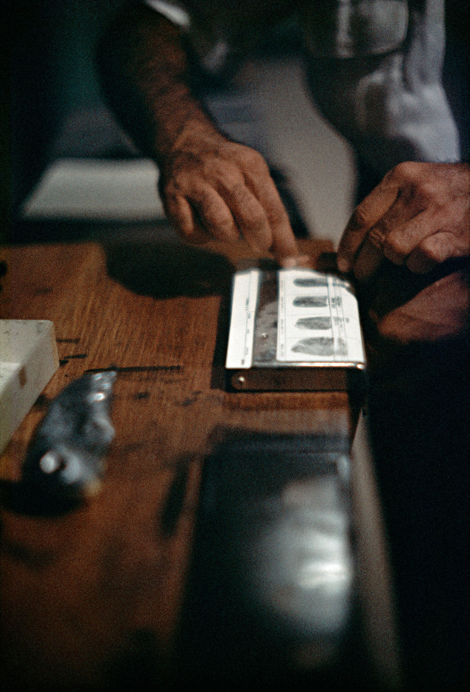 Fingerprinting Addicts for Forging Prescriptions, Chicago, Illinois, 1957 (© Courtesy The Gordon Parks Foundation)