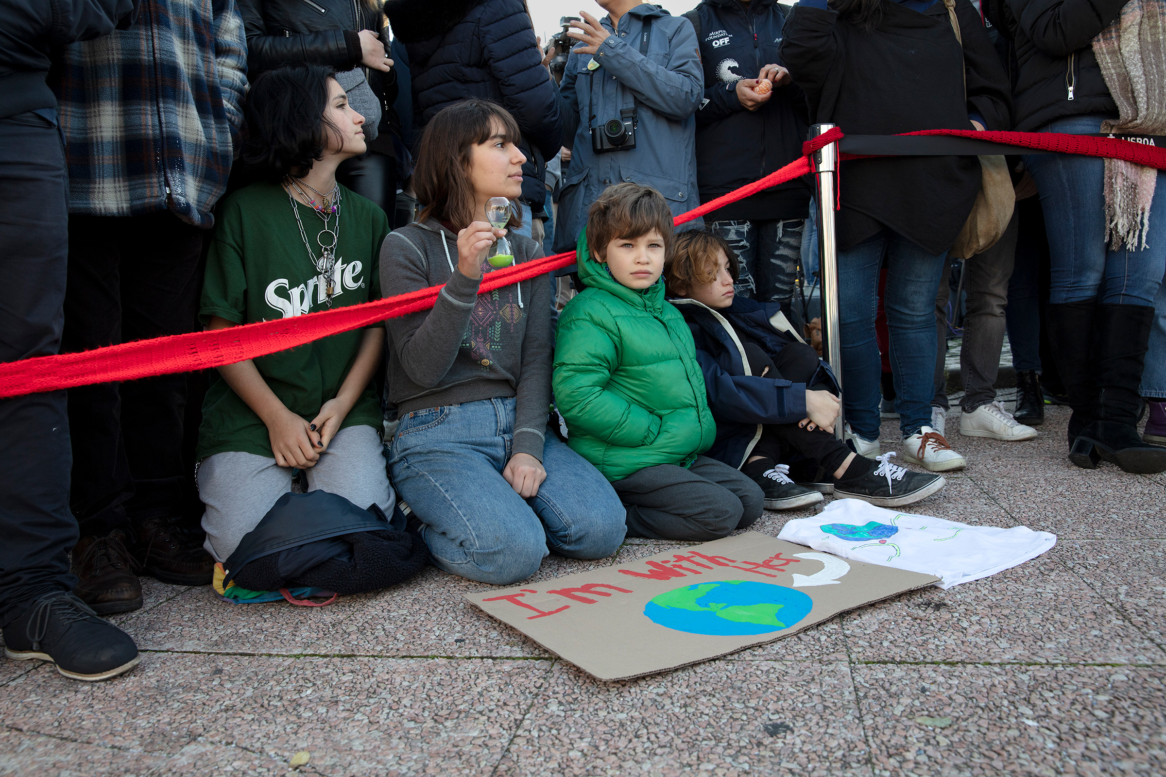 Young supporters of Greta Thunberg await her arrival in Santo Amaro Recreation dock on December 03, 2019 in Lisbon, Portugal. (Evgenia Arbugaeva for TIME)
