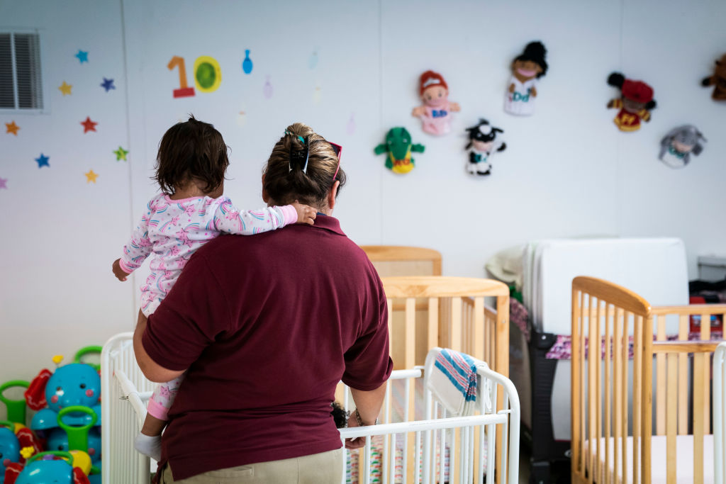Immigrant infants are looked after in a daycare as U.S. Immigration and Customs Enforcement (ICE) and Enforcement and Removal Operations (ERO) hosts a media tour at the South Texas Family Residential Center, which houses families who are pending disposition of their immigration cases on Friday, Aug 23, 2019 in Dilley, TX. (Photo by Jabin Botsford/The Washington Post via Getty Images)
