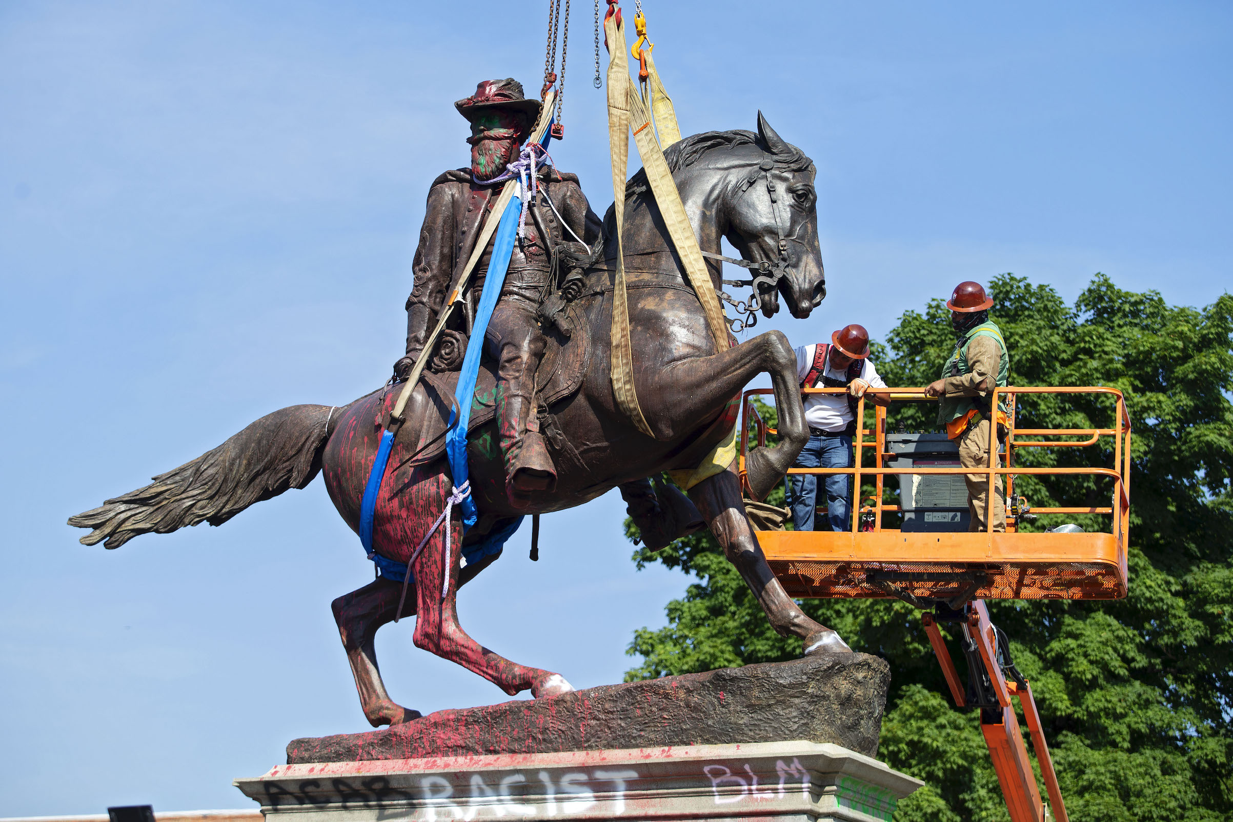 The statue of Confederate General J.E.B. Stuart is removed from Monument Avenue in Richmond, Va., on July 7, 2020 (Ryan M. Kelly—AFP via Getty Images)
