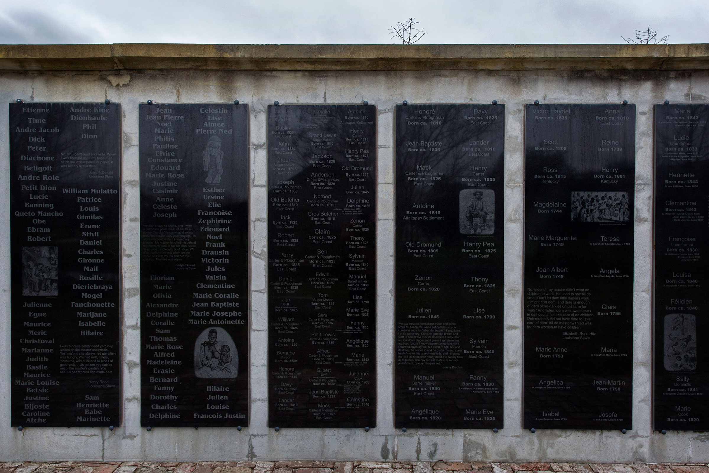 A memorial wall at the Whitney Plantation with the names of slaves who were at the plantation in Wallace, Louisiana