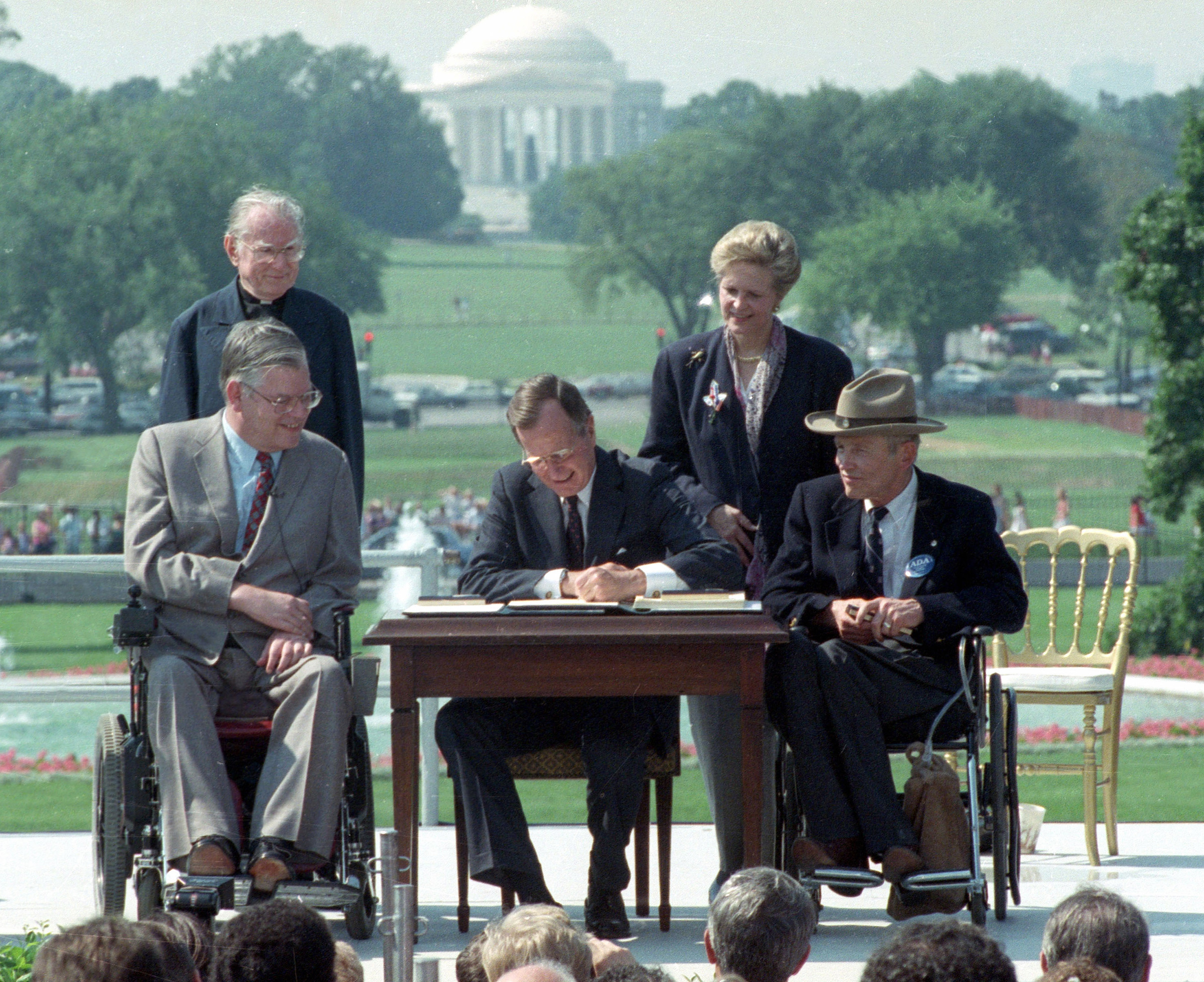 President George H.W. Bush signs the ADA in 1990
